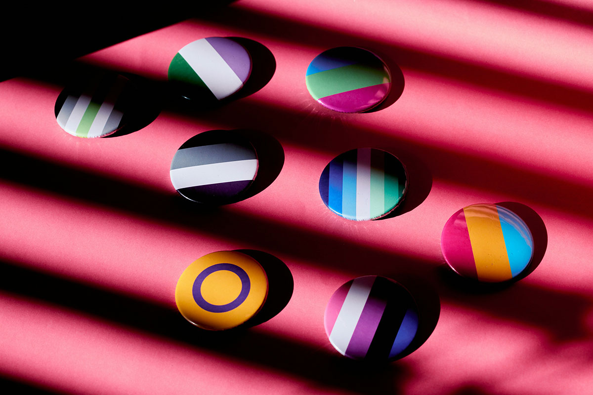 A selection of LGBTQ+ pride badges representing diverse identities and communities.