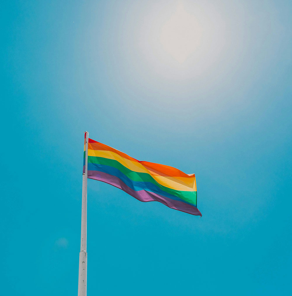 LGBTQ pride flag on flagpole