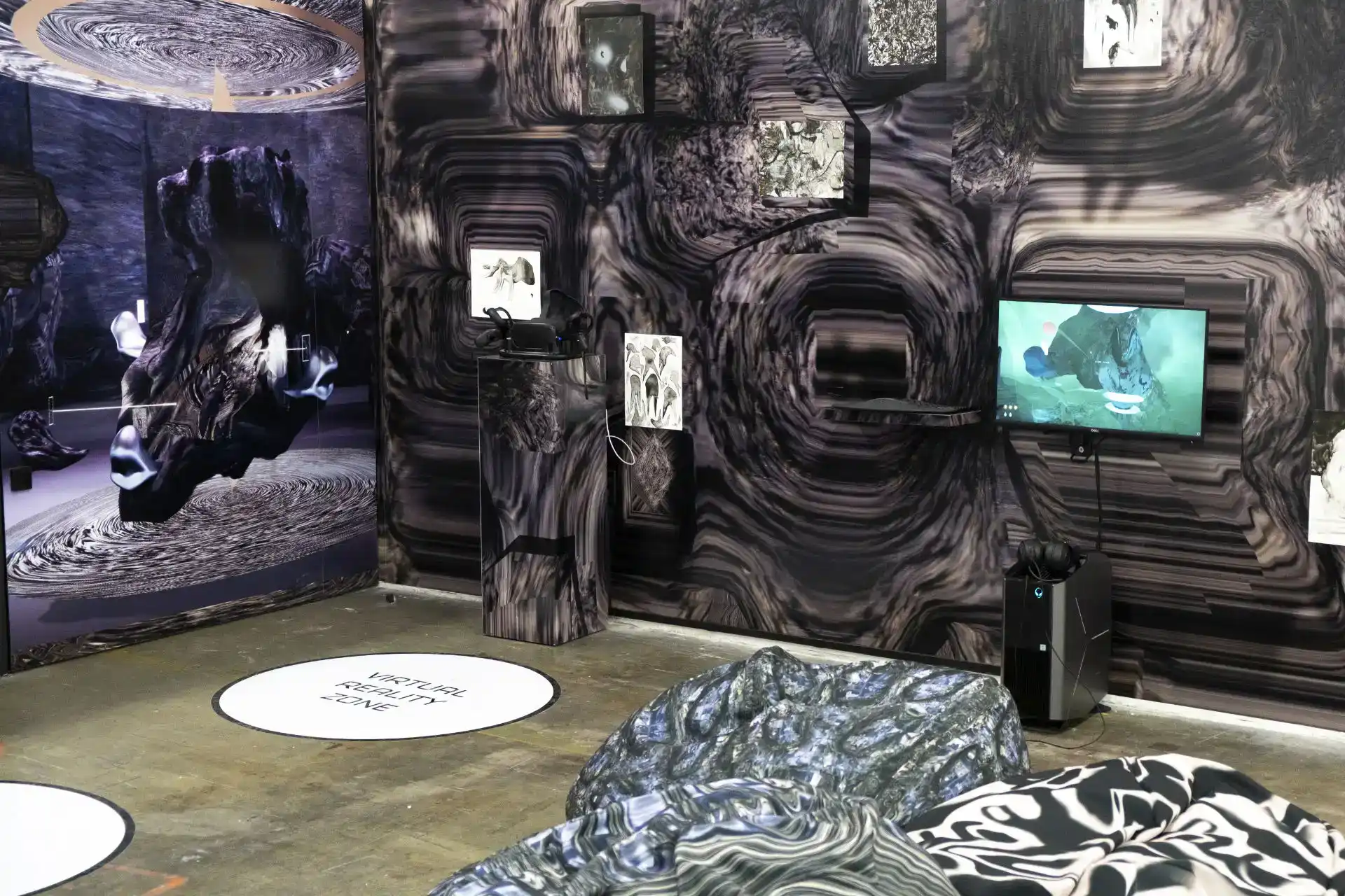MUD Foundation Education, Leo Castaneda’s Intensity Testing exhibition for MUD 2.0, featuring a black-and-white immersive installation with distorted textures, digital artworks, a display screen, and sculptural elements arranged throughout the gallery.