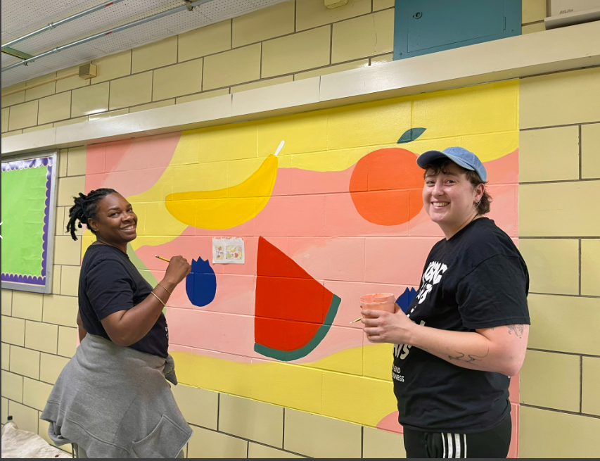 Painting a colorful mural at P.S. K140