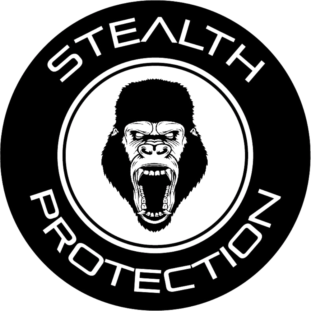 Angry gorilla head with open mouth inside circle, with words Stealth Protection around it.