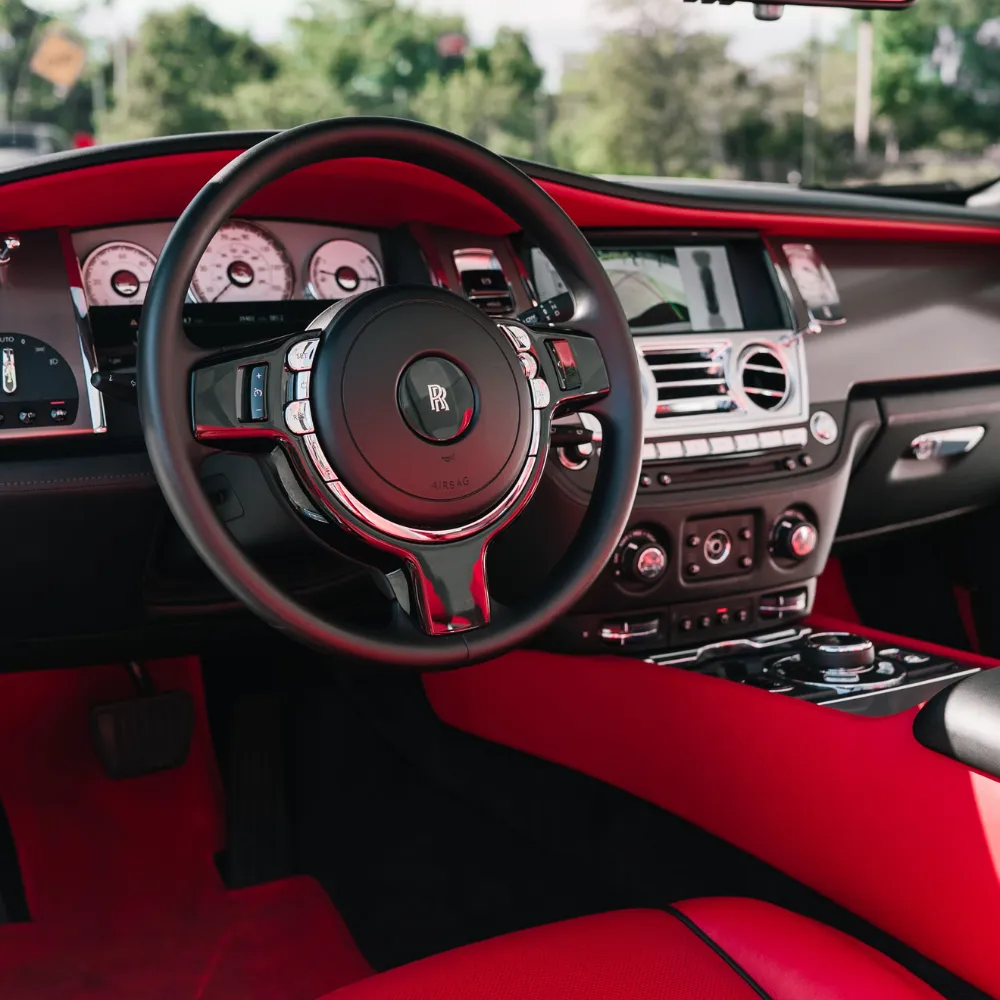 Rolls-Royce Dawn steering wheel and dashboard with red leather interior