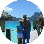 PC DoctorZ customer couple standing together beside tropical blue water