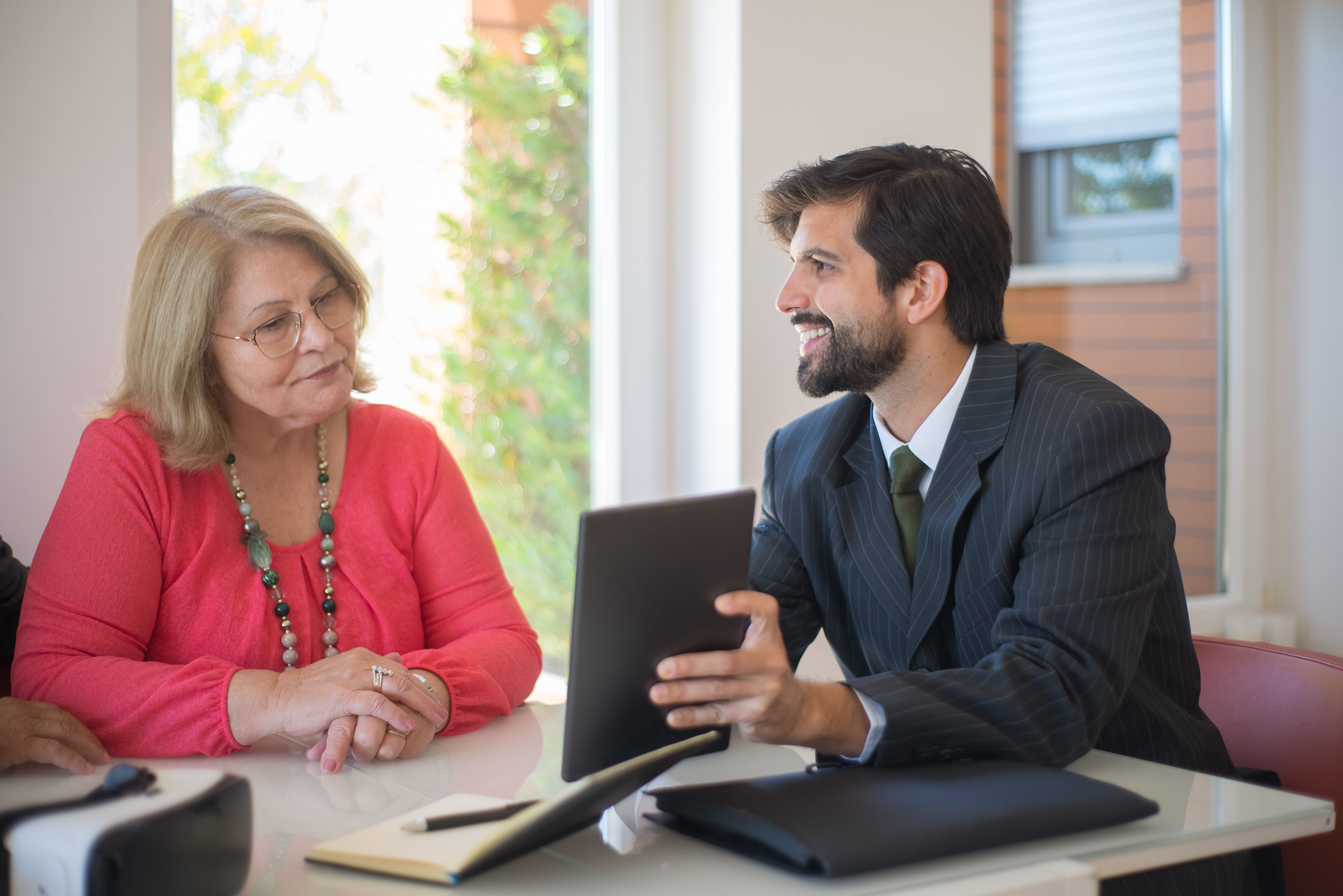 A lead advisor working through a decision with a junior colleague