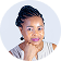 Smiling woman with braided hair wearing a white top against a light background.