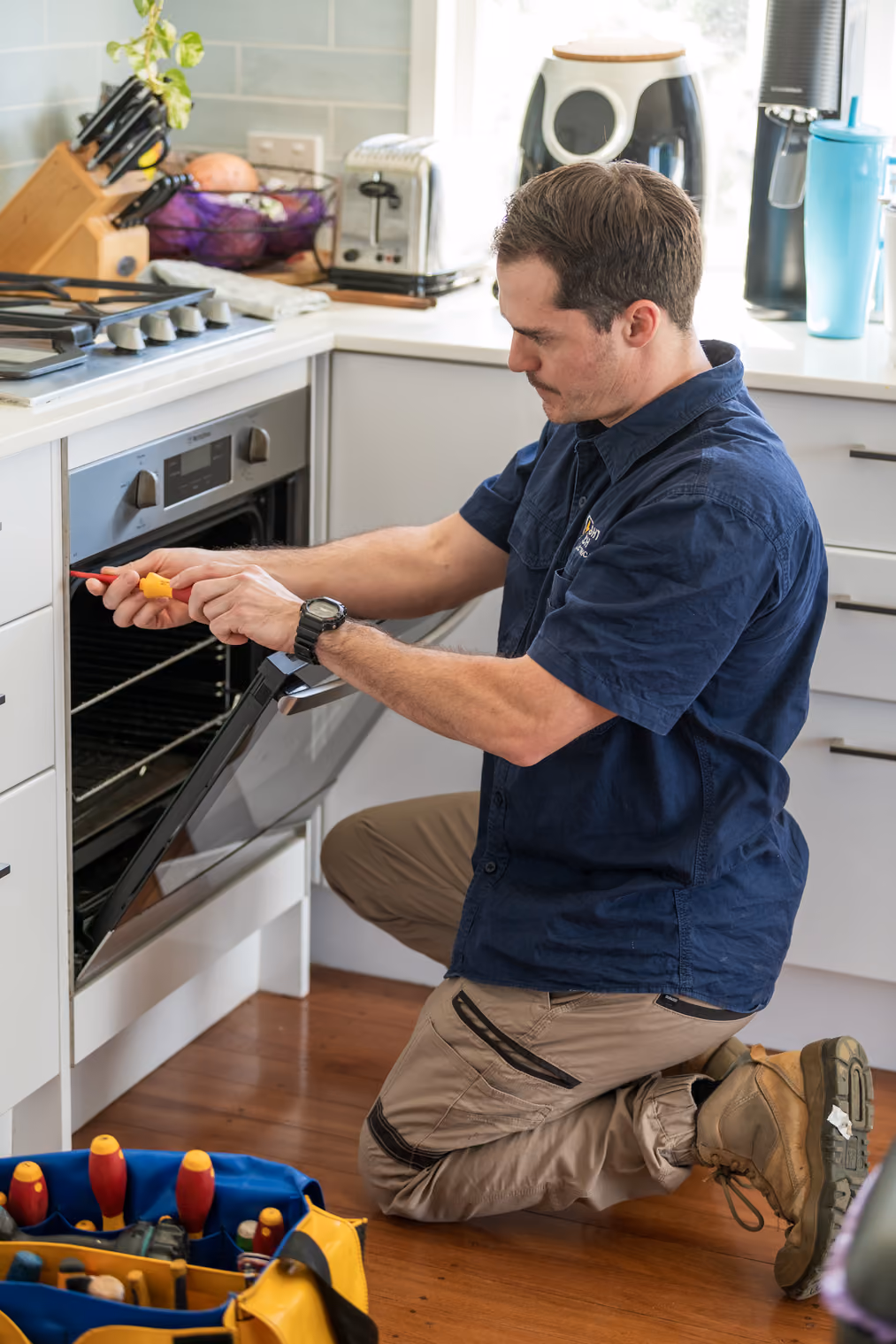 Electrician installing lighting and ceiling fans in Brisbane