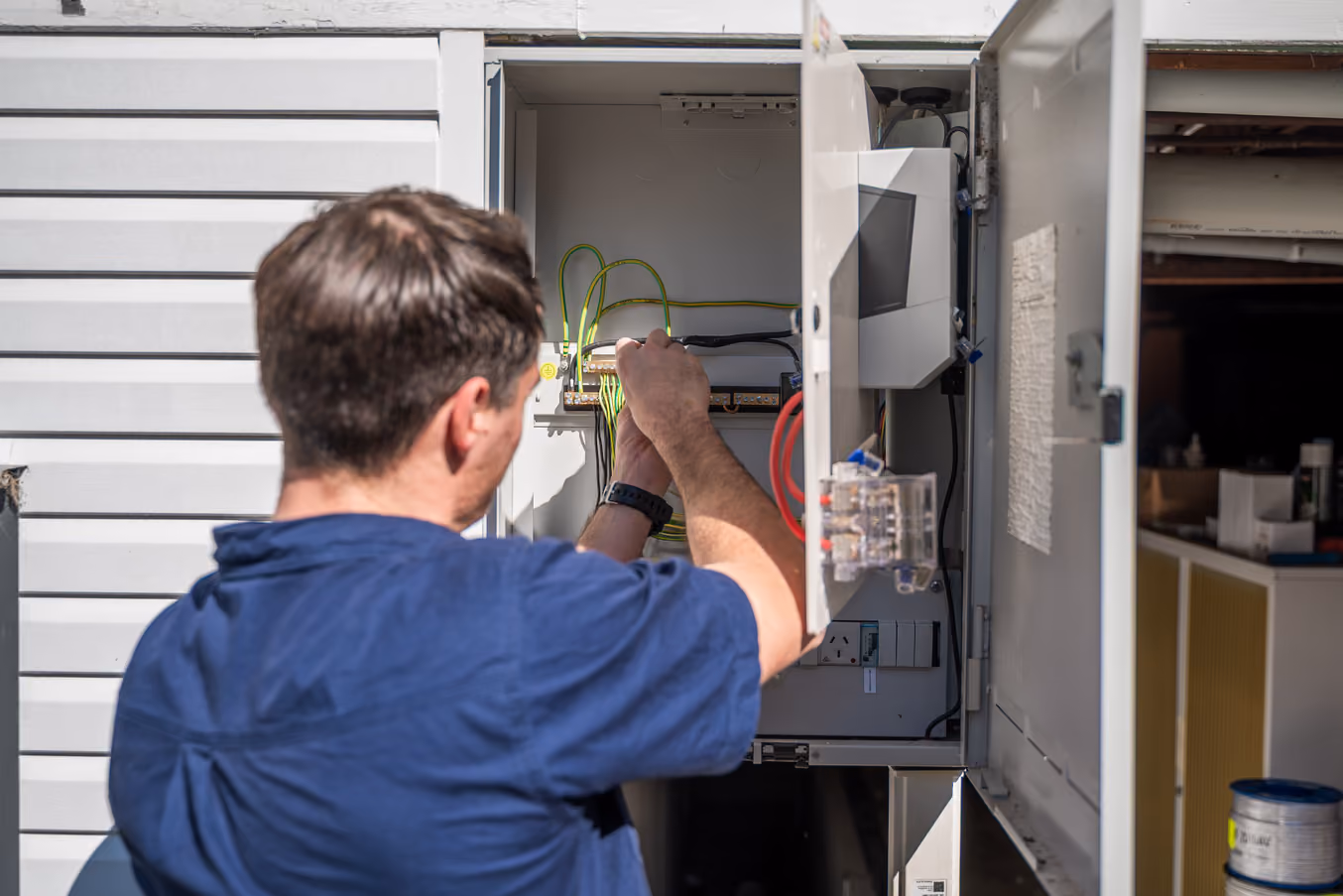 Electrician installing lighting and ceiling fans in Brisbane