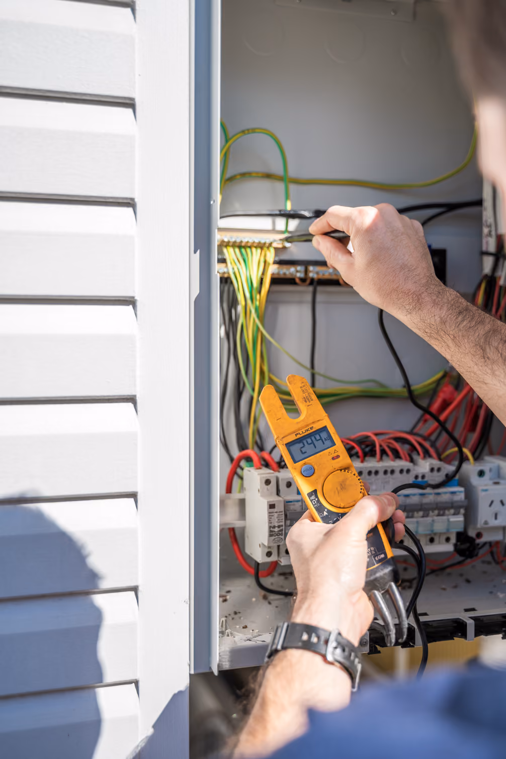 Electrician installing lighting and ceiling fans in Brisbane