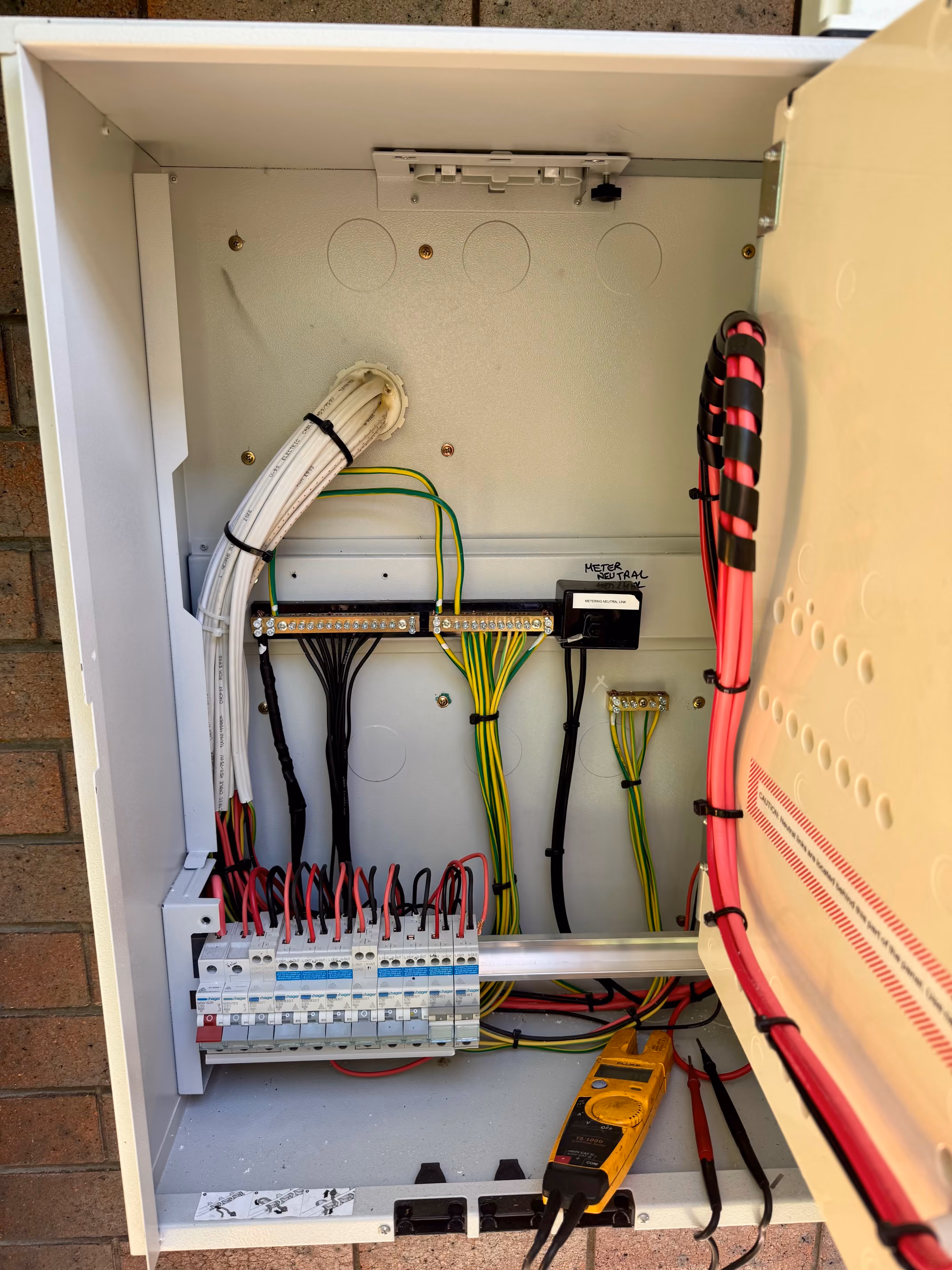 Electrician installing lighting and ceiling fans in Brisbane