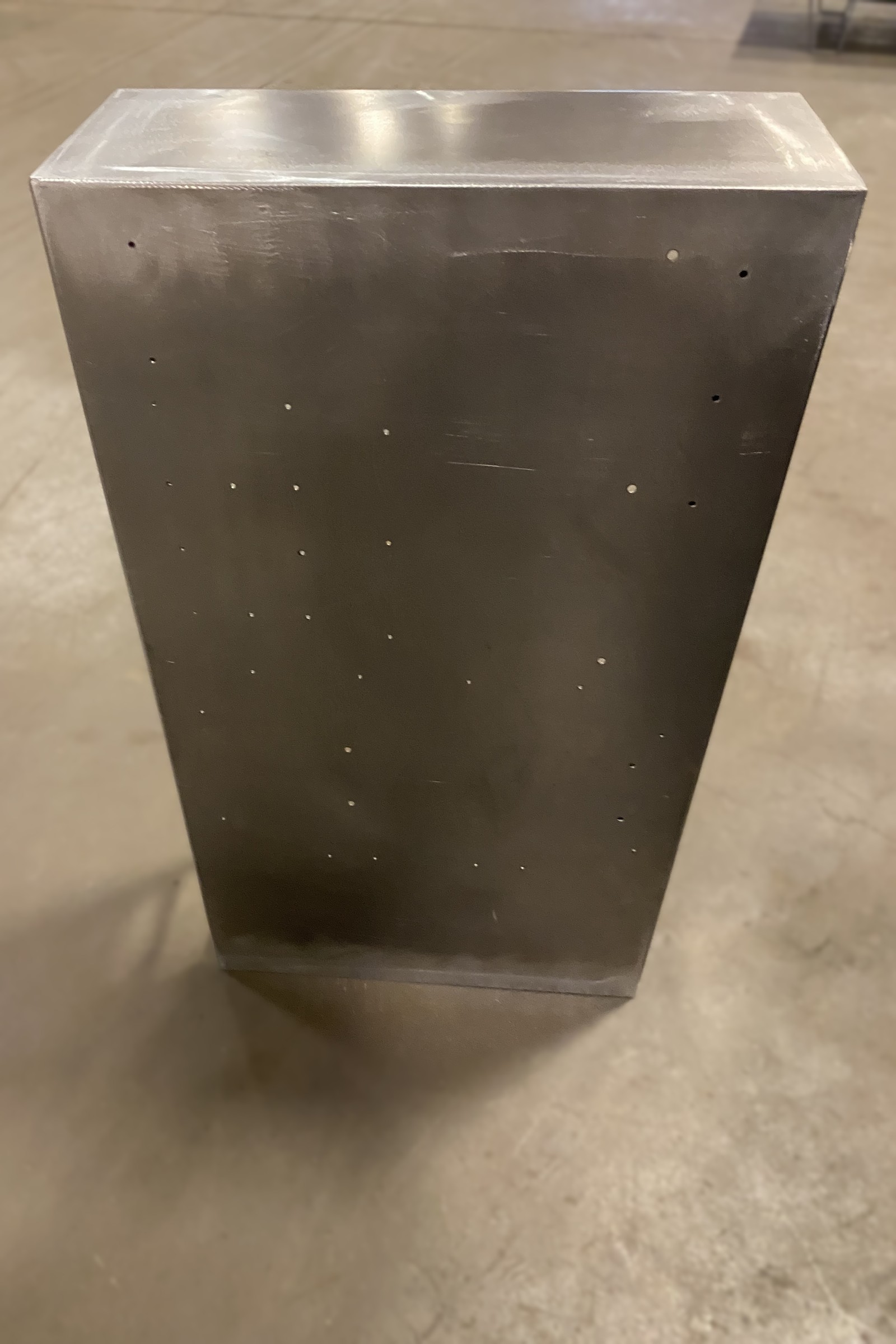 Tapered fabricated metal enclosure body.