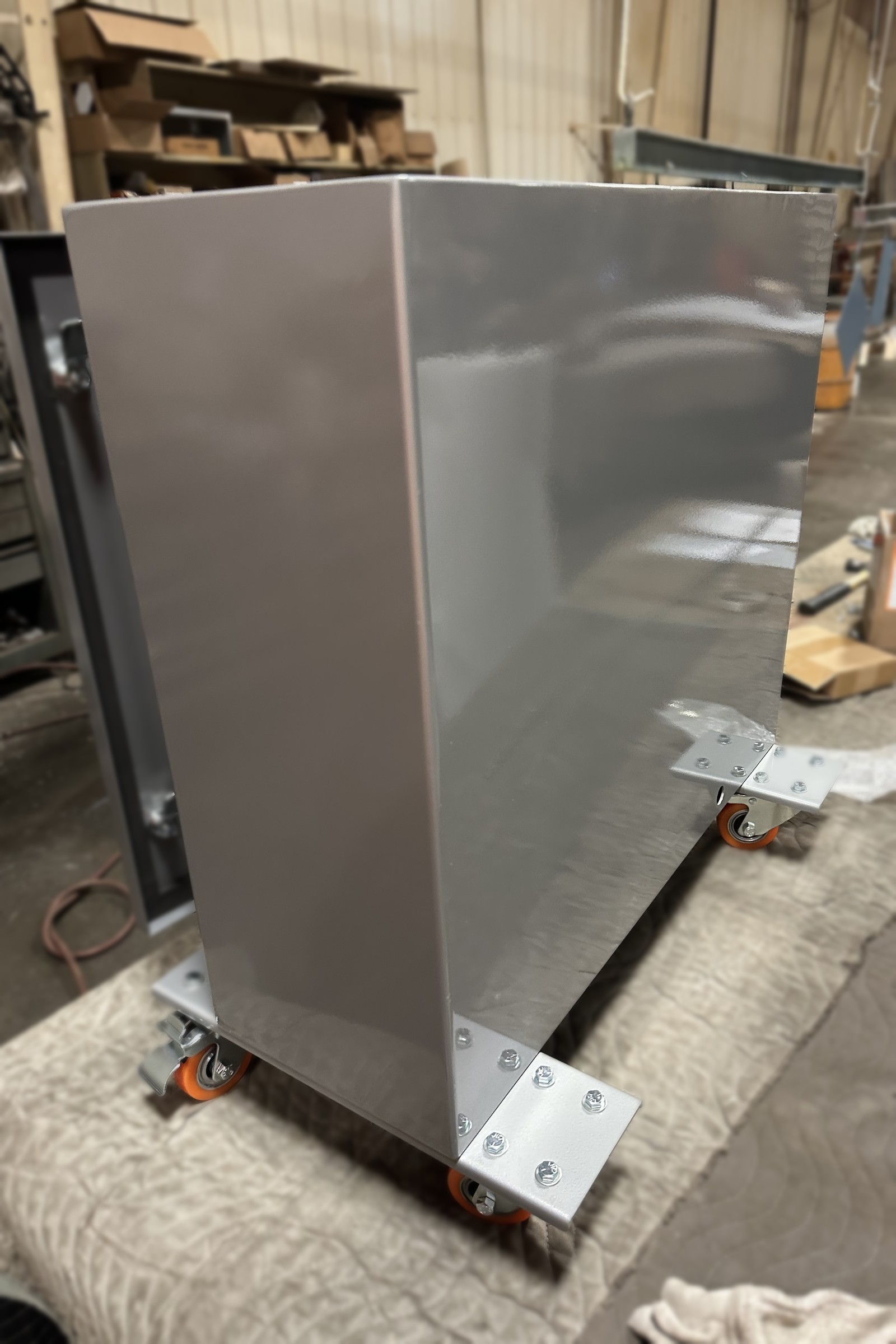 Tapered formed sheet metal body with a bolted mounting base.