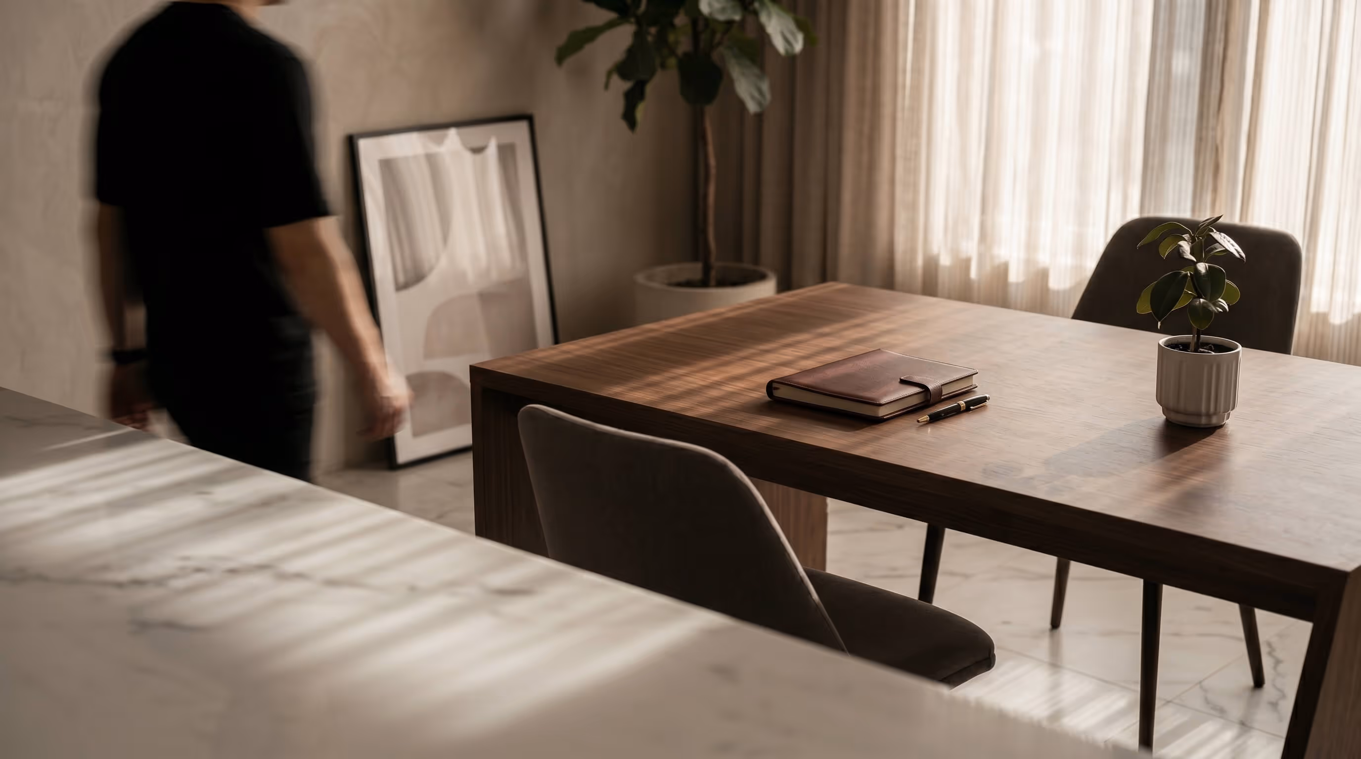 Modern business meeting in a minimalist office interior with natural light and contemporary workspace design.