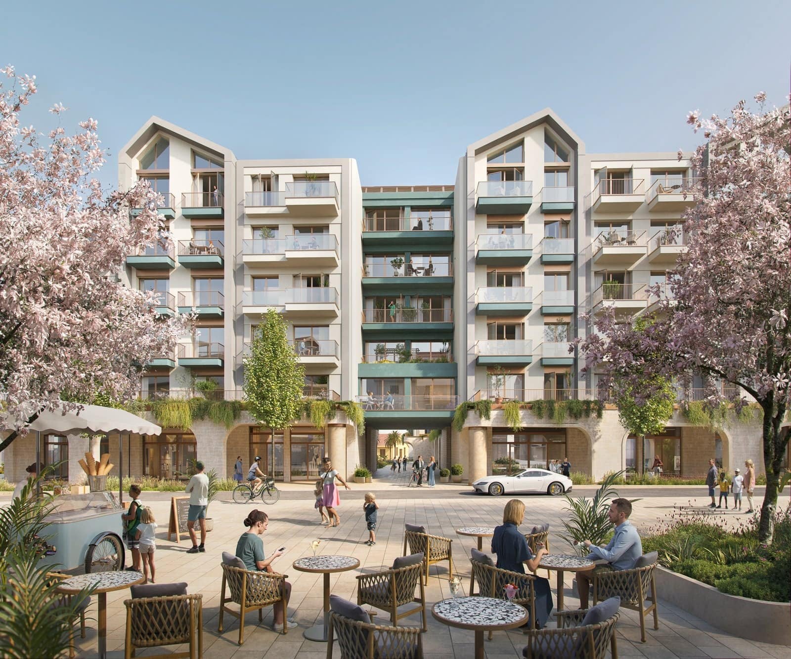 Modern residential building in Montenegro with outdoor seating, trees, and people enjoying the space.