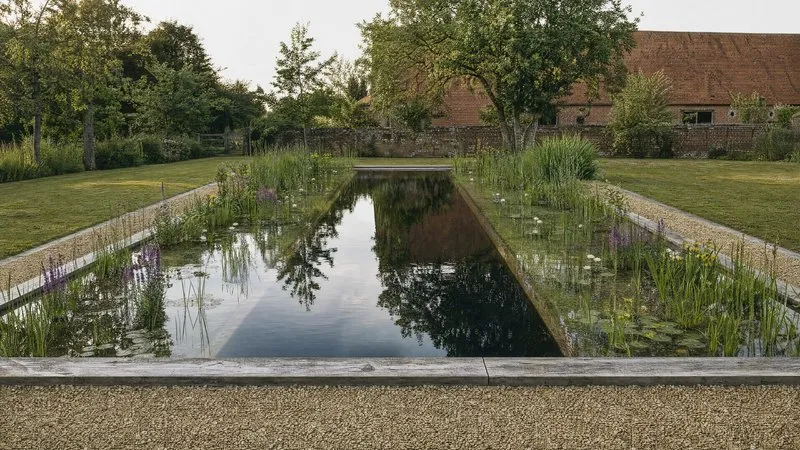 Gravel path leading through the garden to the water