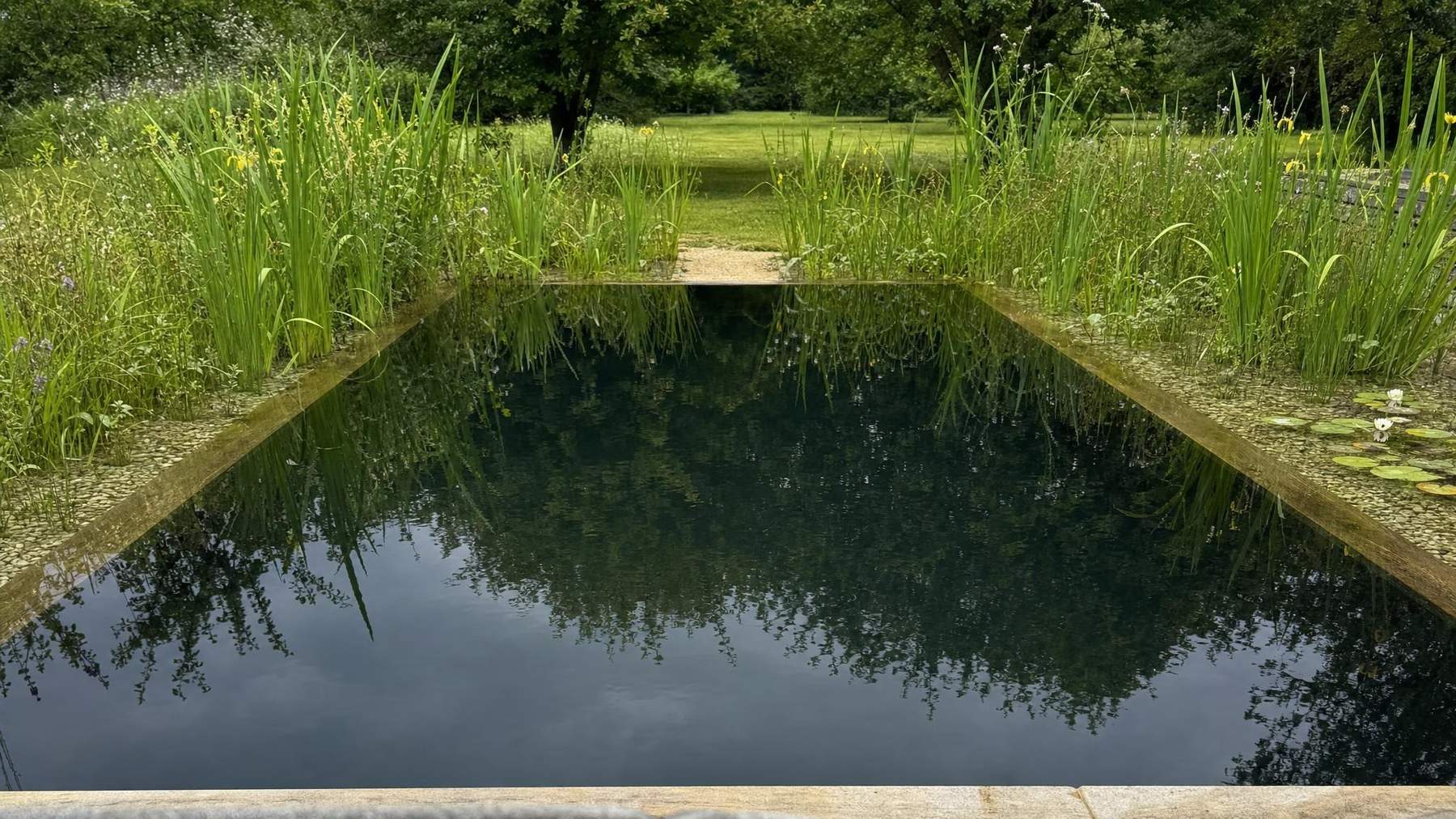 Clear water in the swim zone of a natural pool, kept moving by the pump