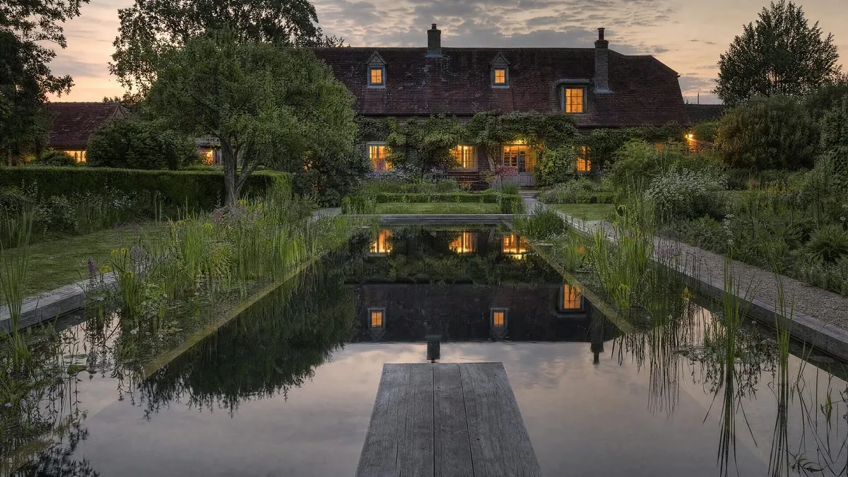 An evening view across a natural swimming pond