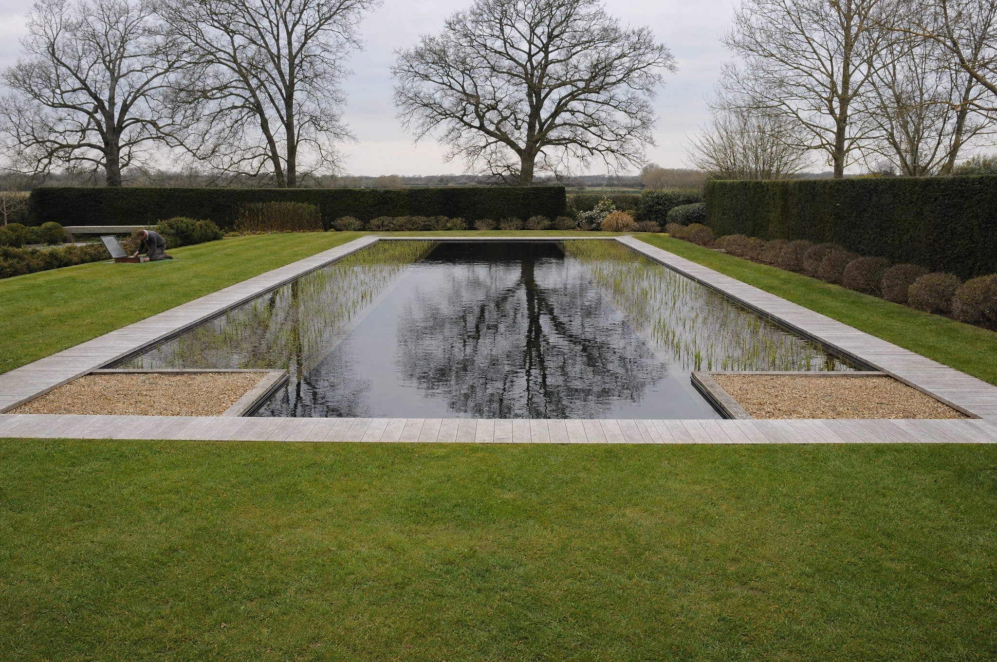 Spring start-up on a natural swimming pool, restarting the air compressor at the pool edge