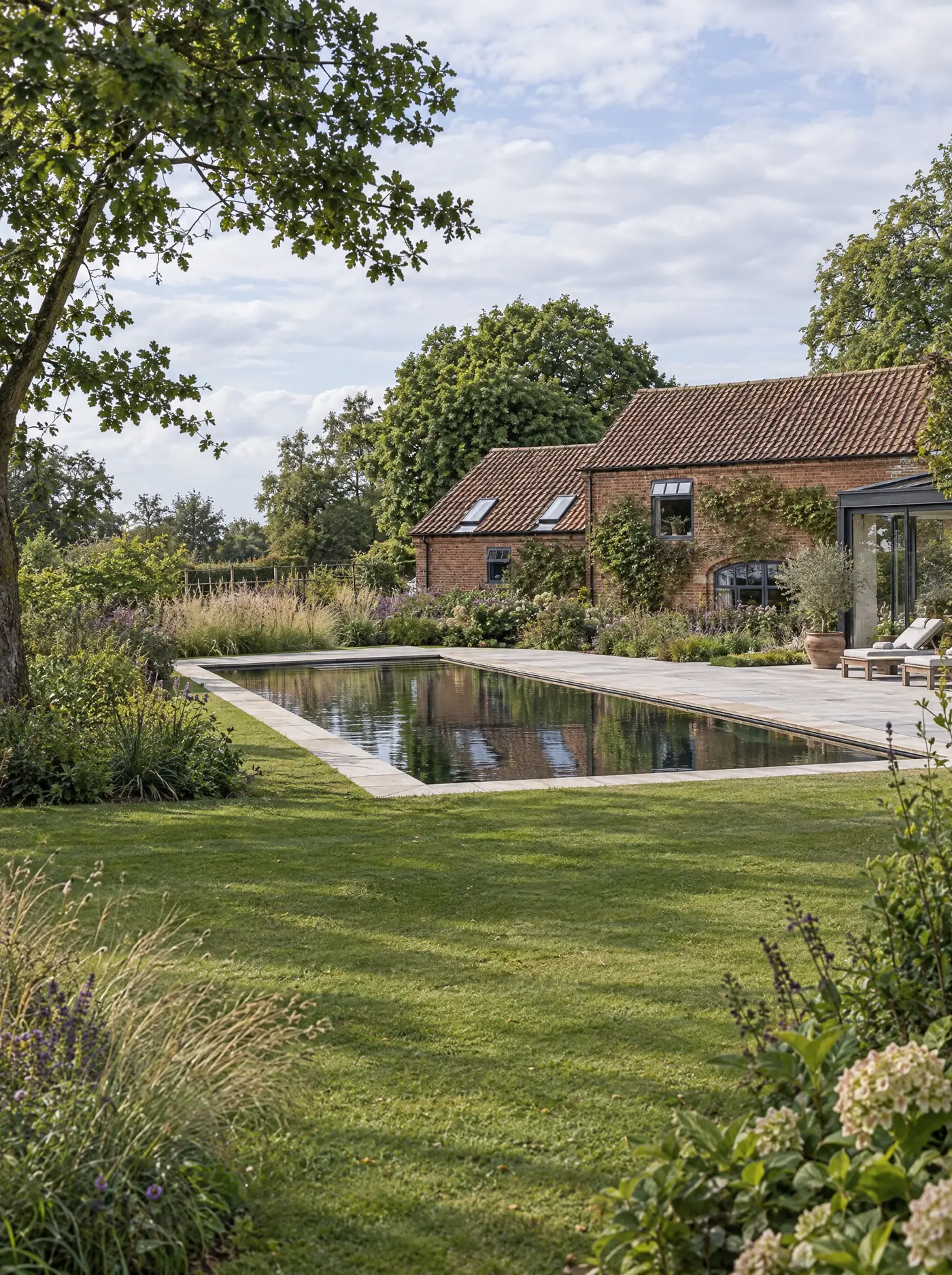 Living pool design inspiration with open swimming water and a contemporary garden setting