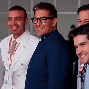 Plastic Surgeons taking a photo with Dr. Hoyos