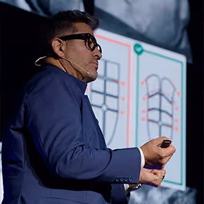 Dr. Hoyos teaching about body contouring on stage