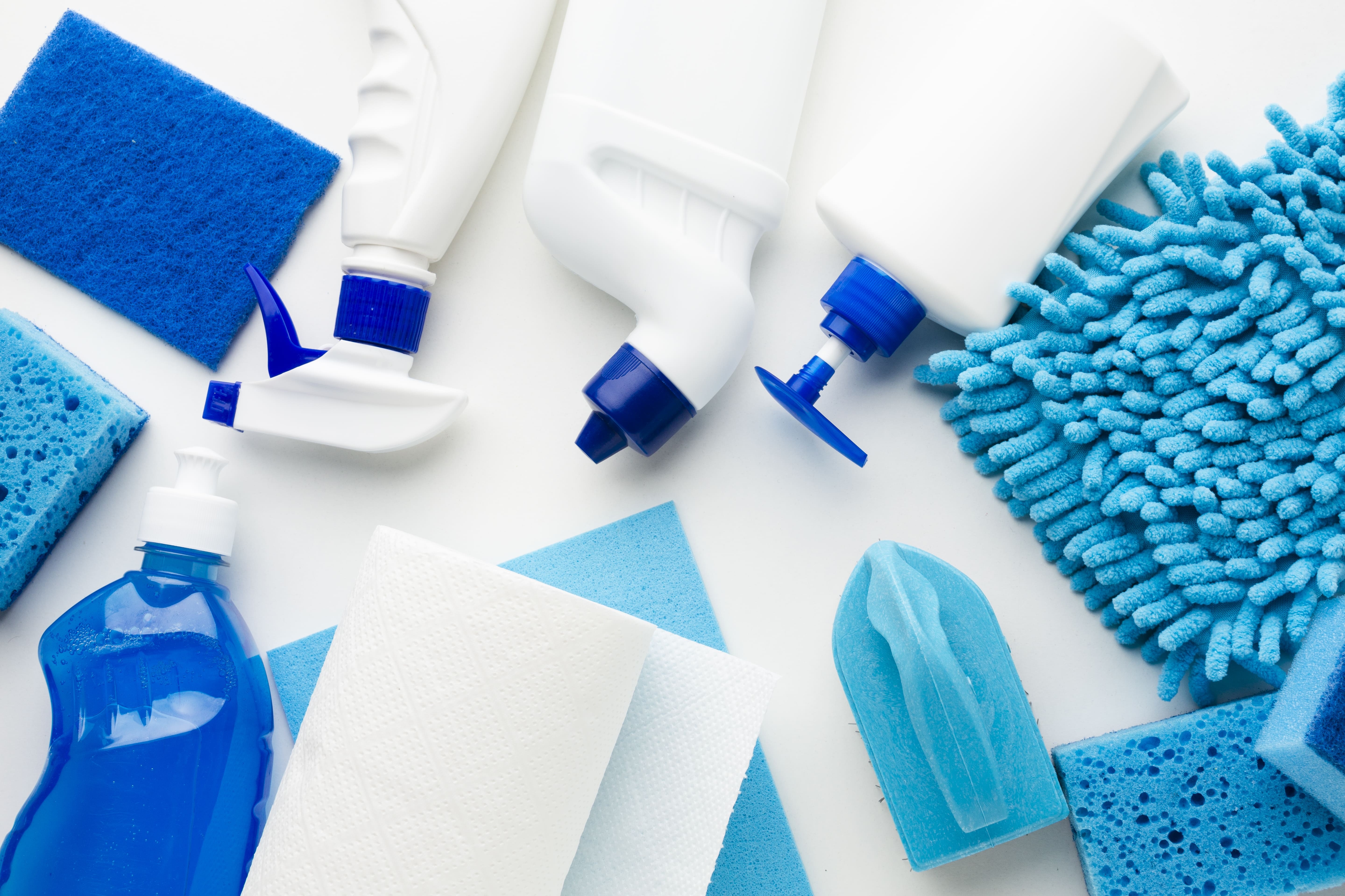 Assortment of household cleaning products, sponges and microfibre cloths