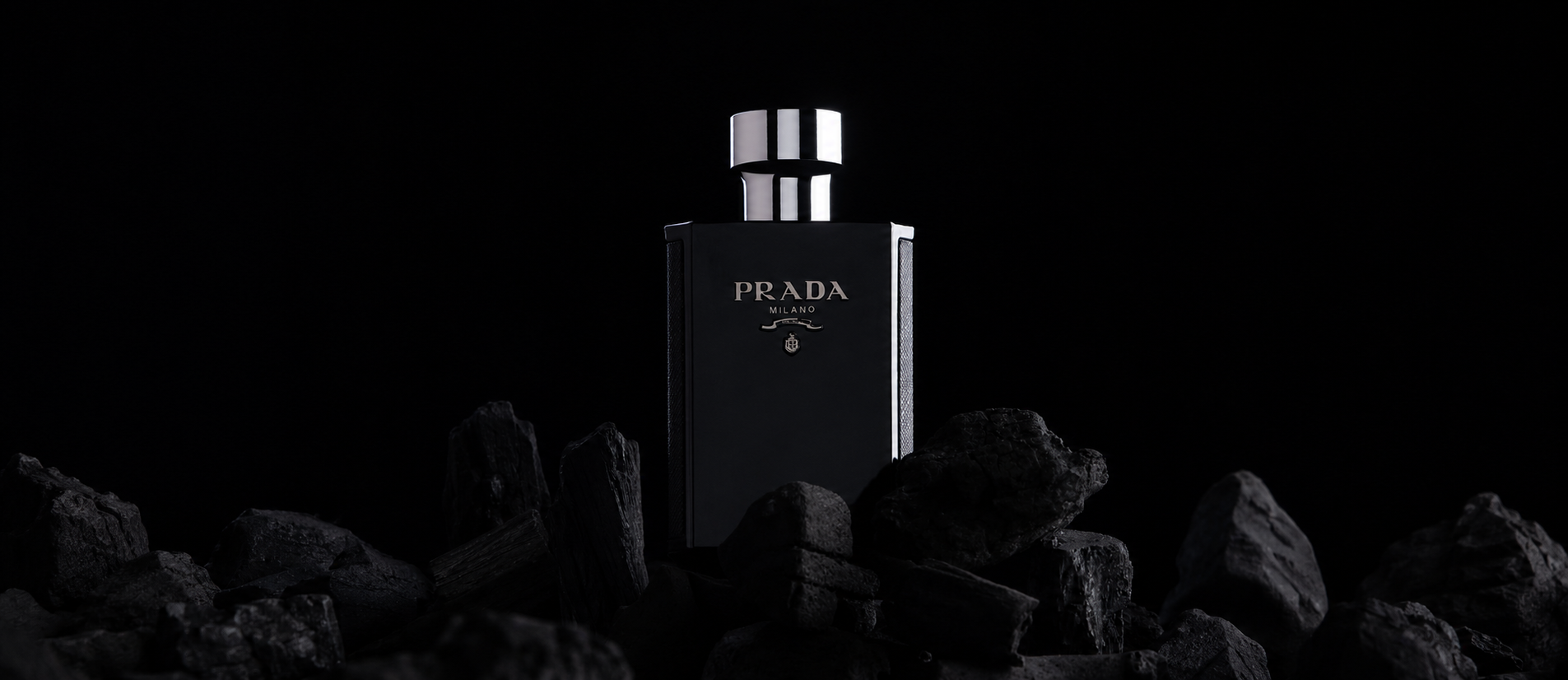 Black Prada fragrance bottle displayed against a dark background