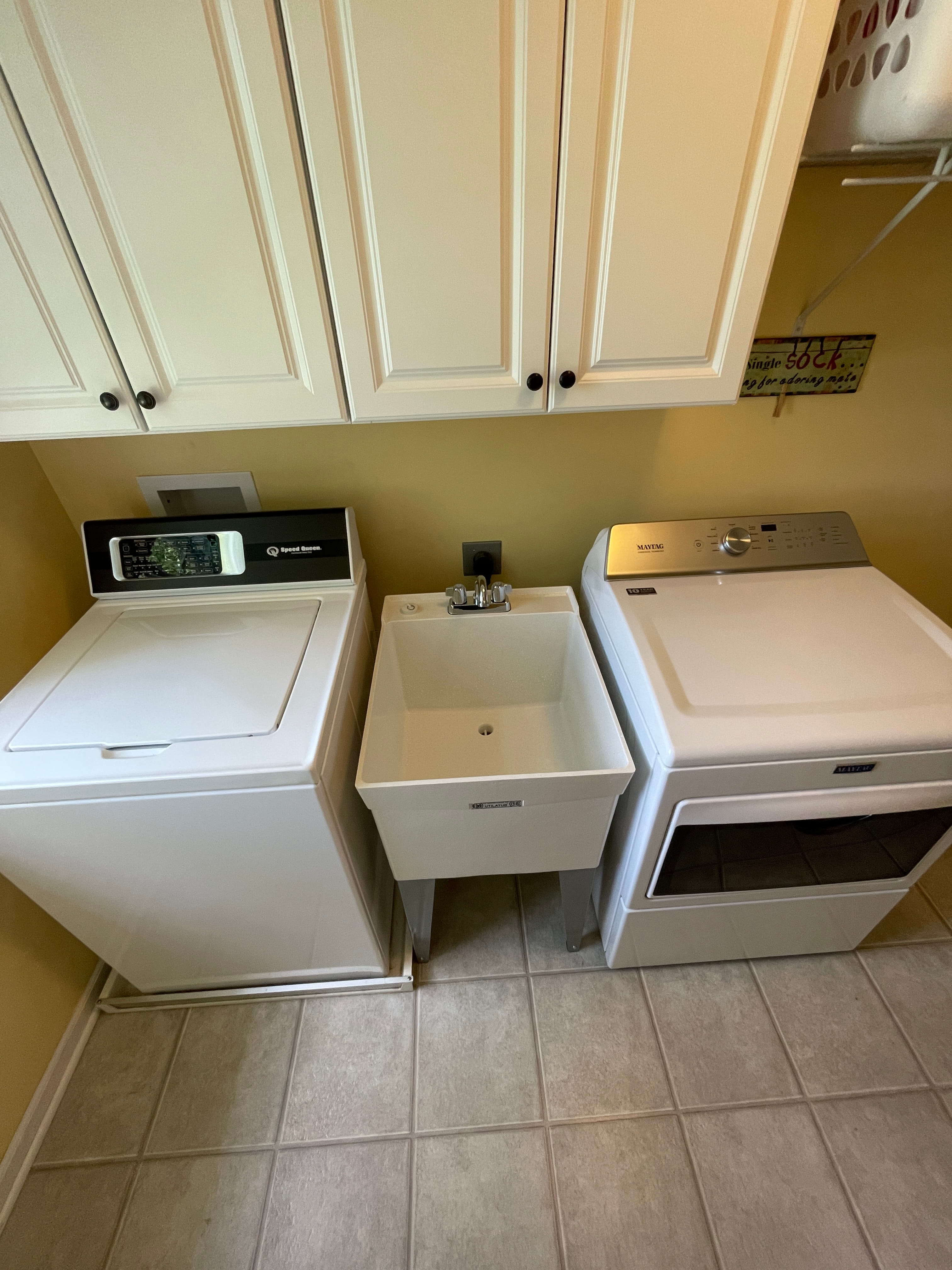 Wash sink added and installed between washer and dryer in laundry room