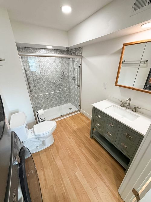 New bathroom with updated shower, sink and toilet