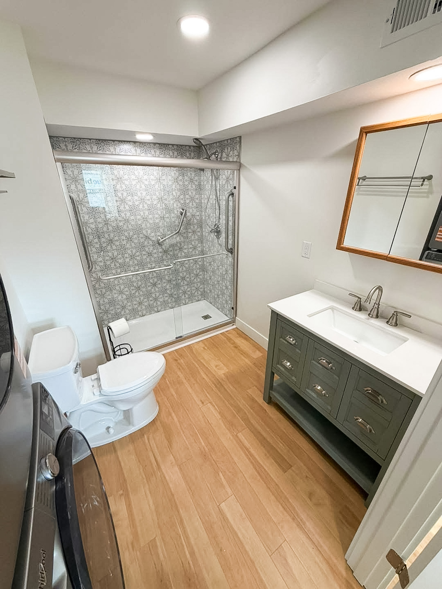 New bathroom with updated shower, sink and toilet