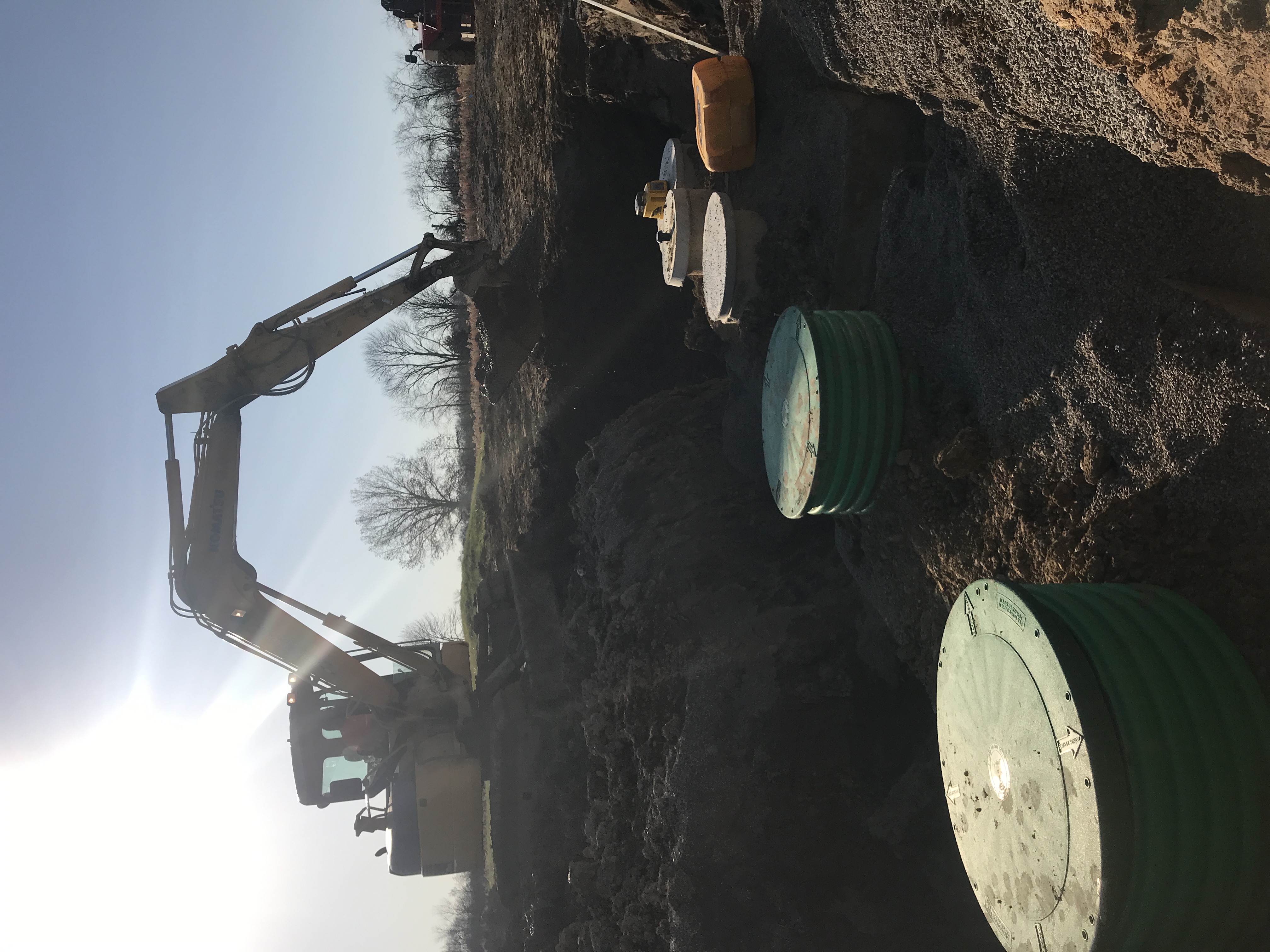 Image of commercial job site with large excavator