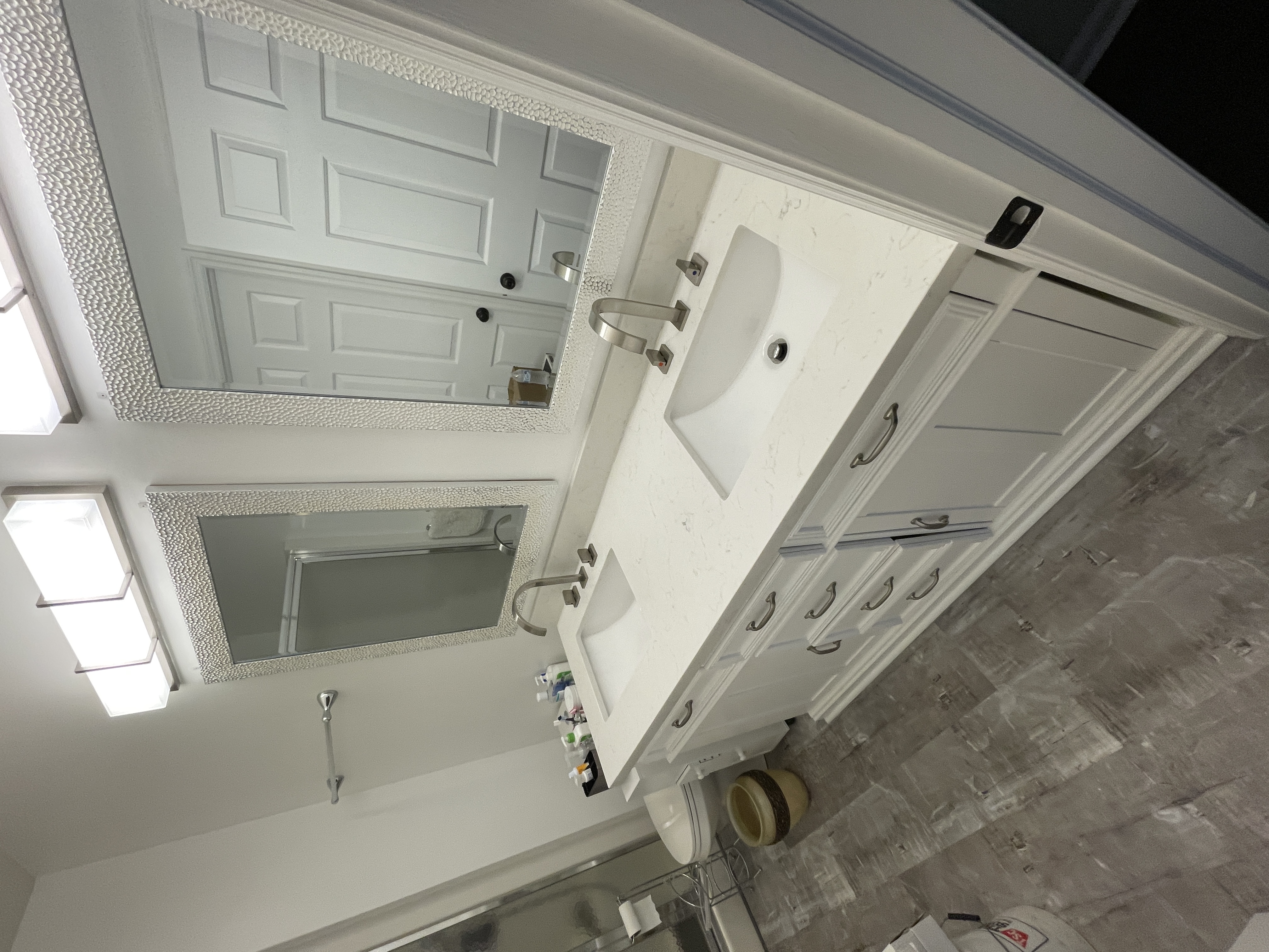 Updated bathroom double vanity with marble counter top and new faucets and fixtures