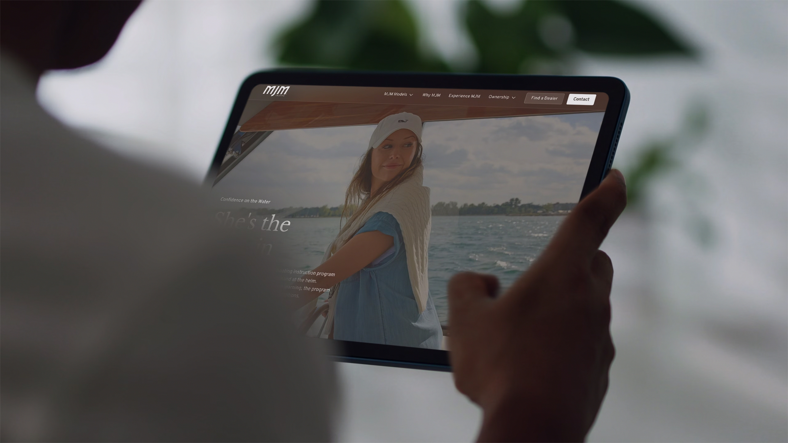 Full-width hero screenshot of the MJM Yachts website