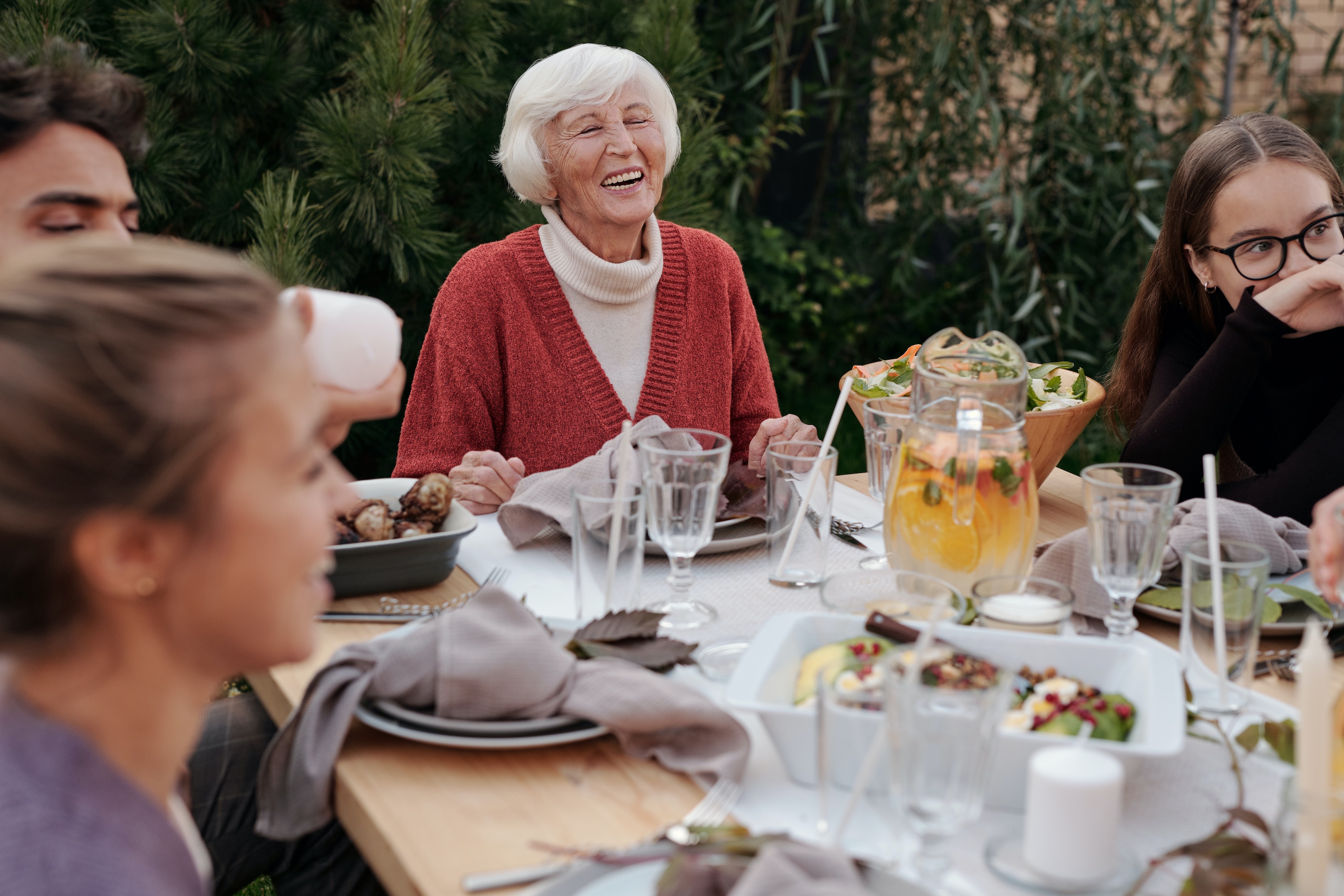 people eating at table stock image