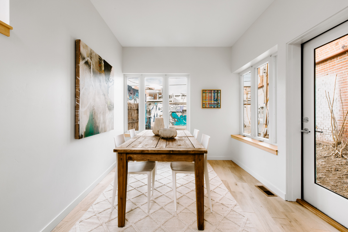 Breakfast room with wood table and a glass door to the yard