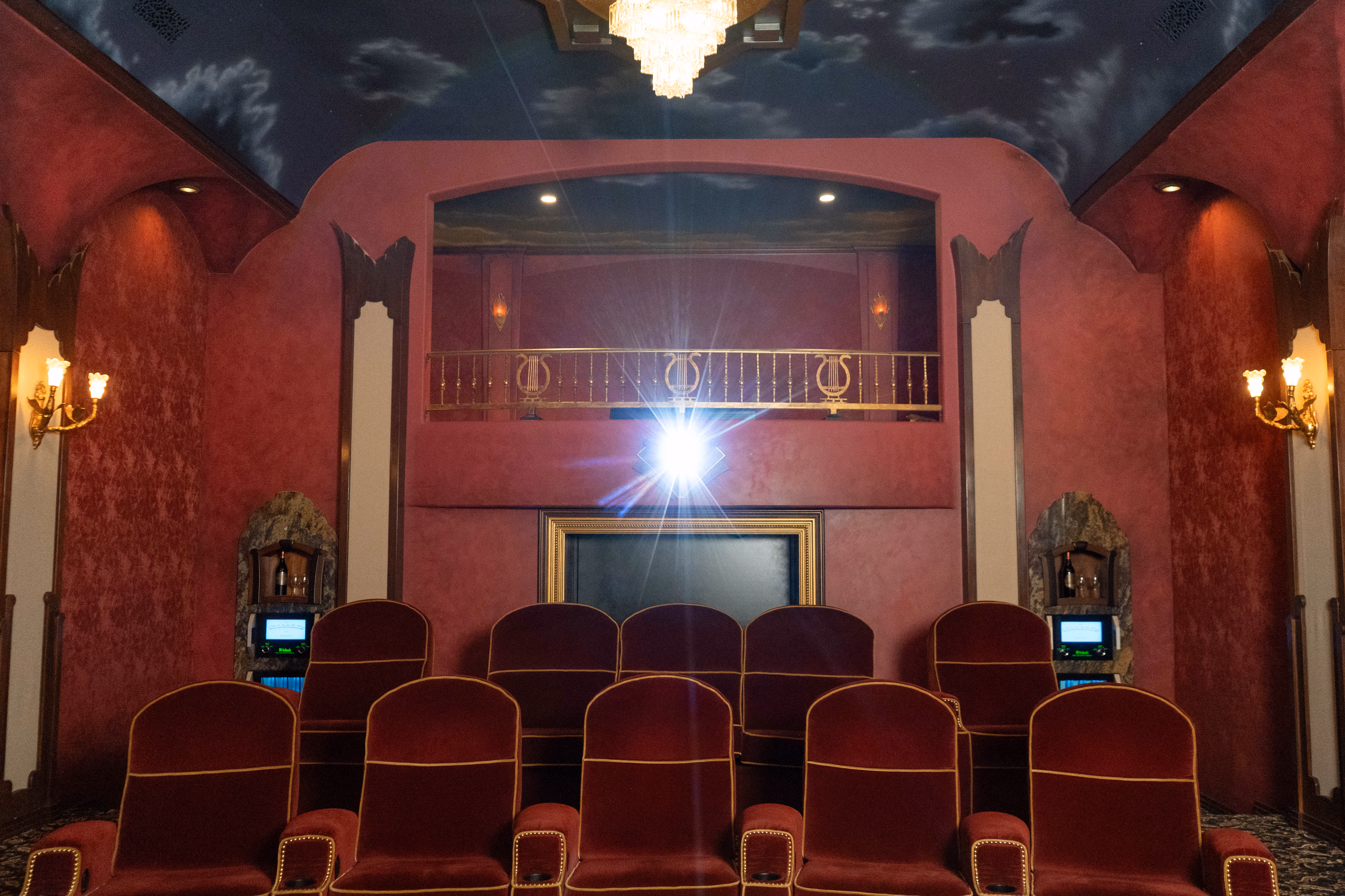 Red velvet seating and hand-painted sky ceiling in The Grand Cinema Suite at LMC Scottsdale