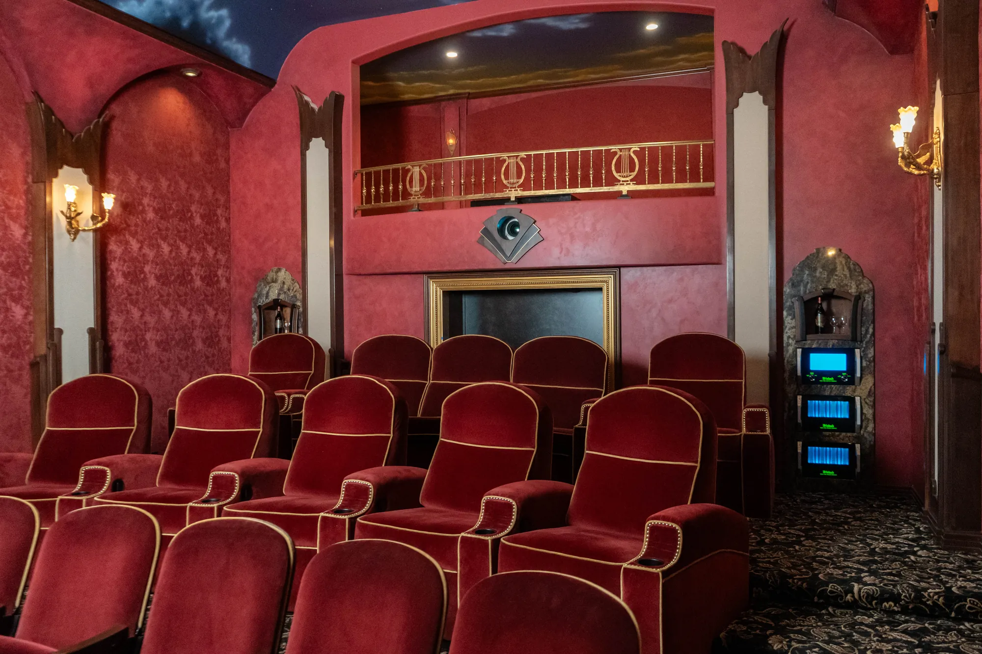 Red velvet seating and McIntosh amplification in The Grand Cinema Suite at LMC Scottsdale