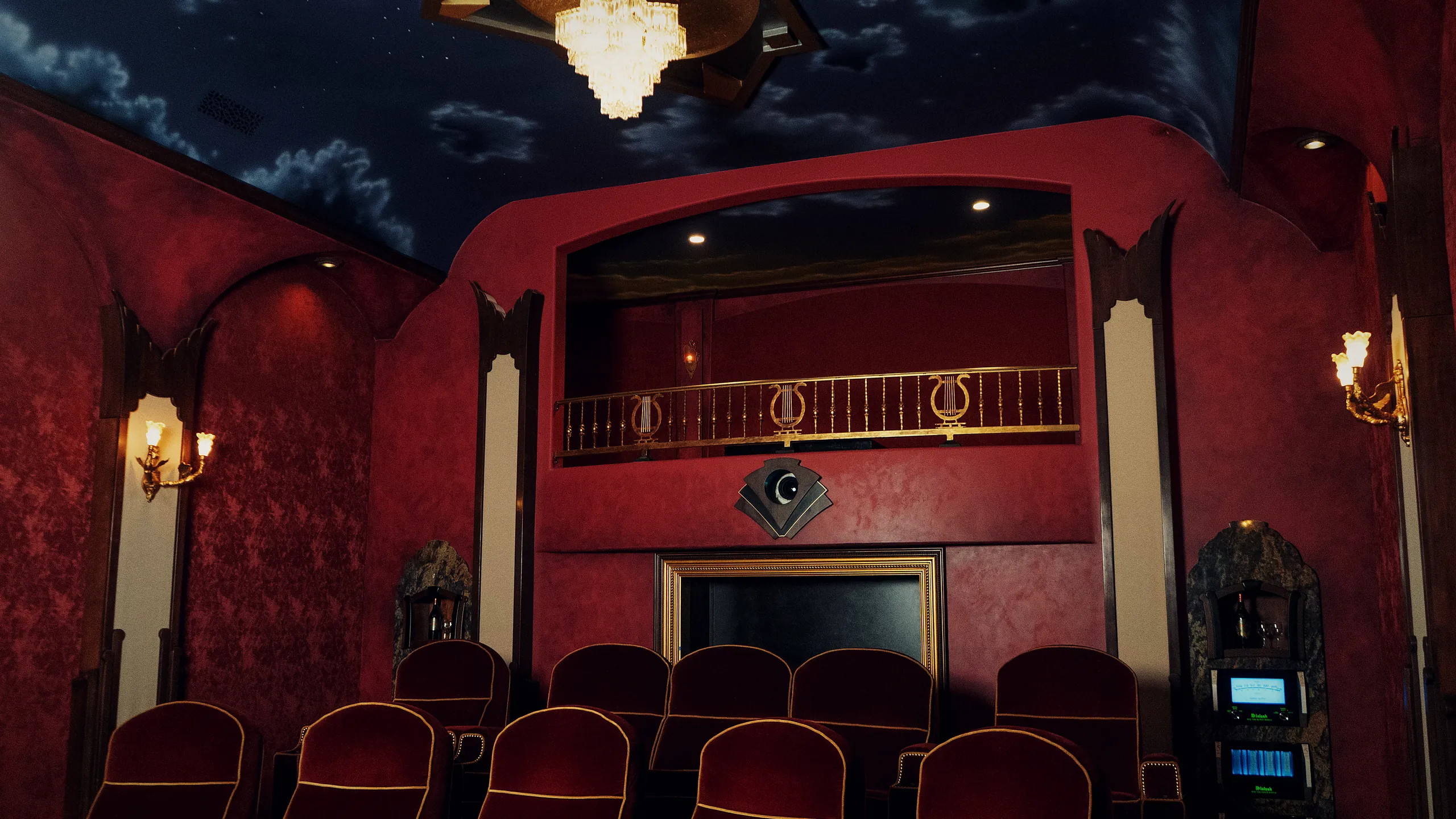 The Grand Cinema Suite at LMC Scottsdale, red velvet seating with McIntosh amplification