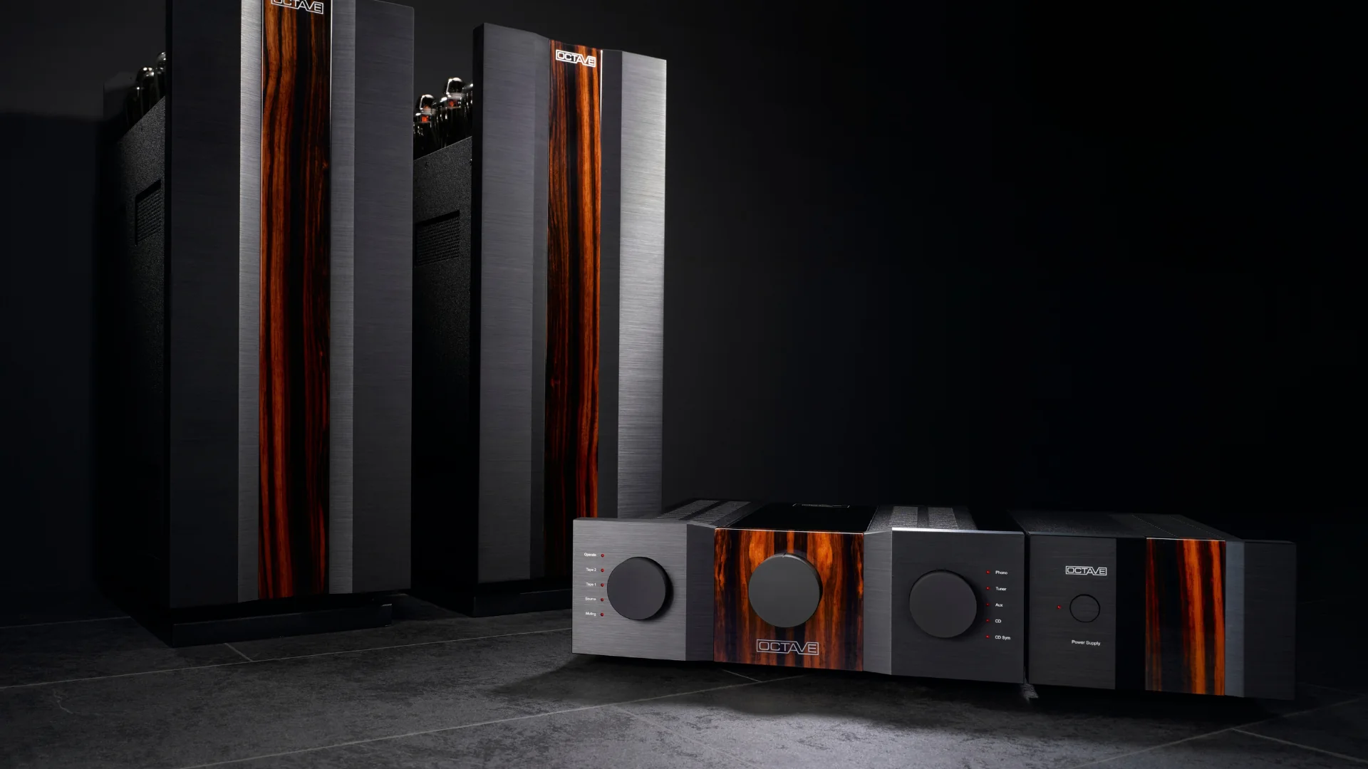 Octave Jubilee preamplifier and Jubilee Mono amplifiers in black with wood inlays