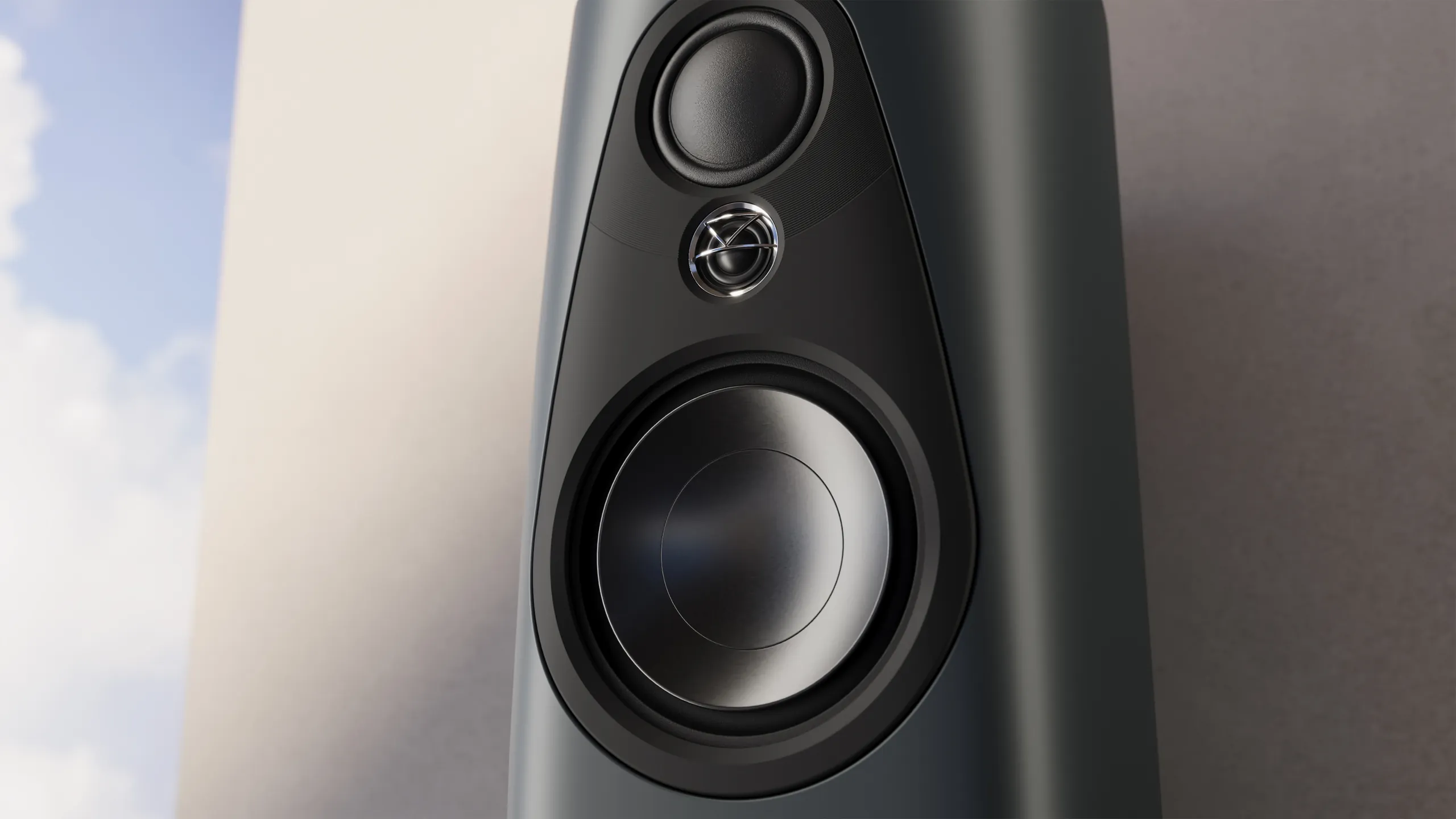 Close-up of the Linn 343 loudspeaker array in Triton finish against a sky backdrop
