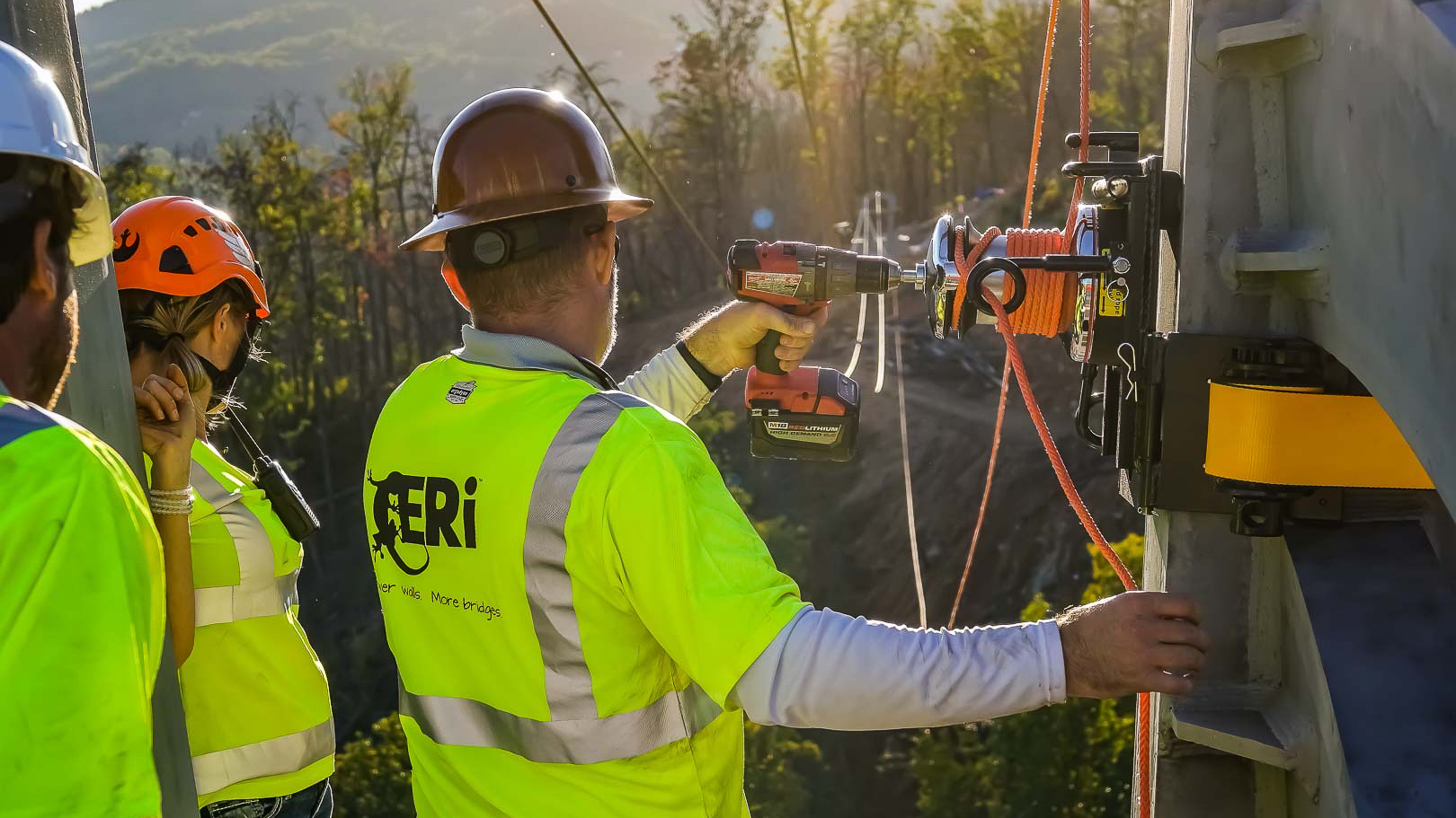 ERi Experiential Resources crew installing bridge cable
