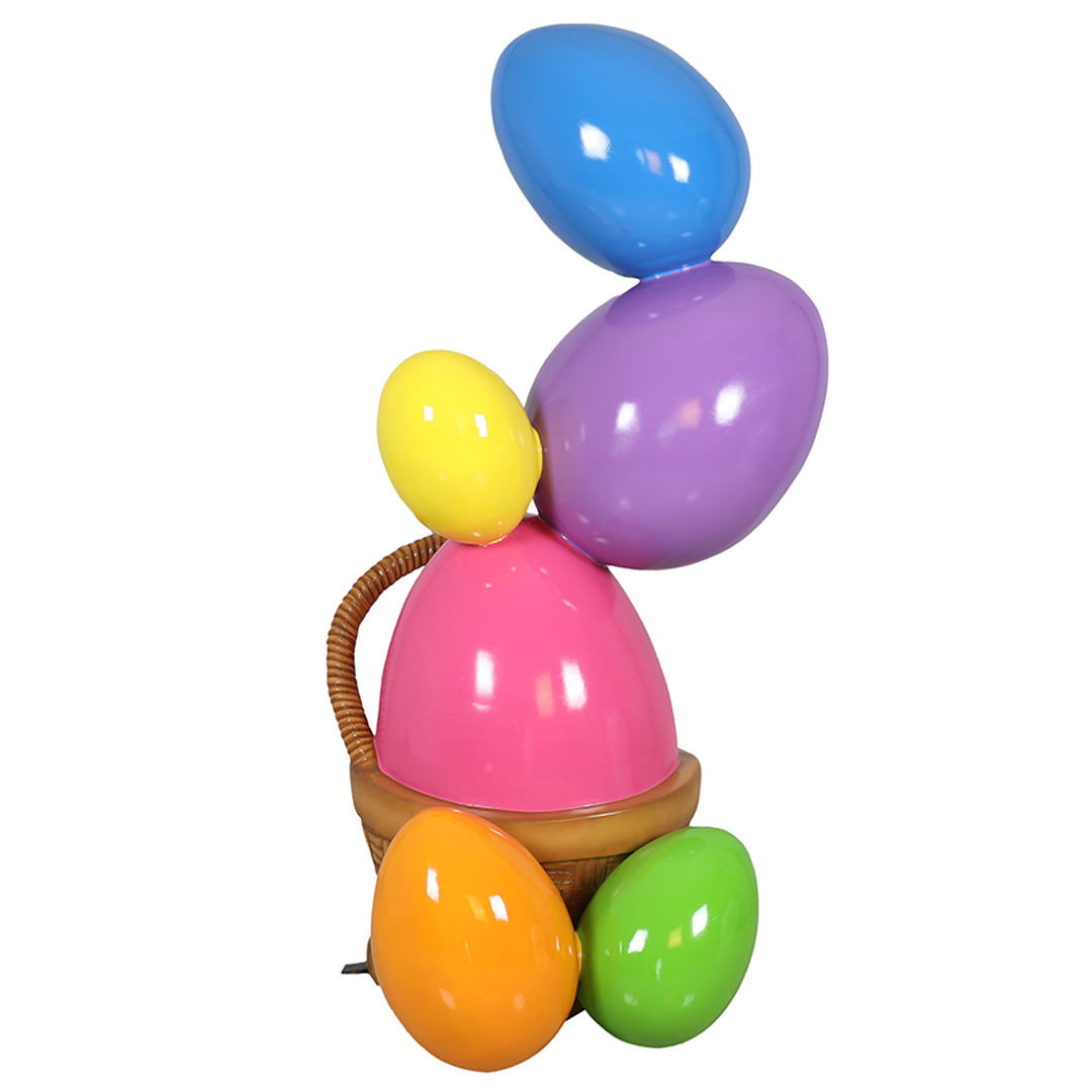 Decorative basket filled with colorful, shiny oversized eggs in blue, purple, pink, yellow, orange, and green.