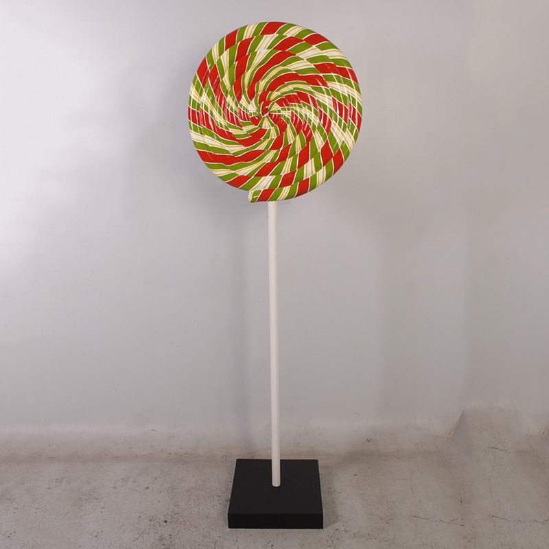 Large decorative lollipop with red, green, and white swirls on a white stick with a black base.