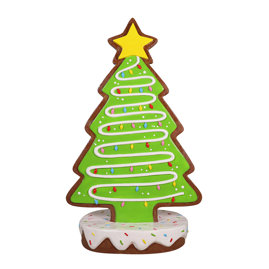 Gingerbread cookie shaped like a Christmas tree decorated with icing and a yellow star on top.