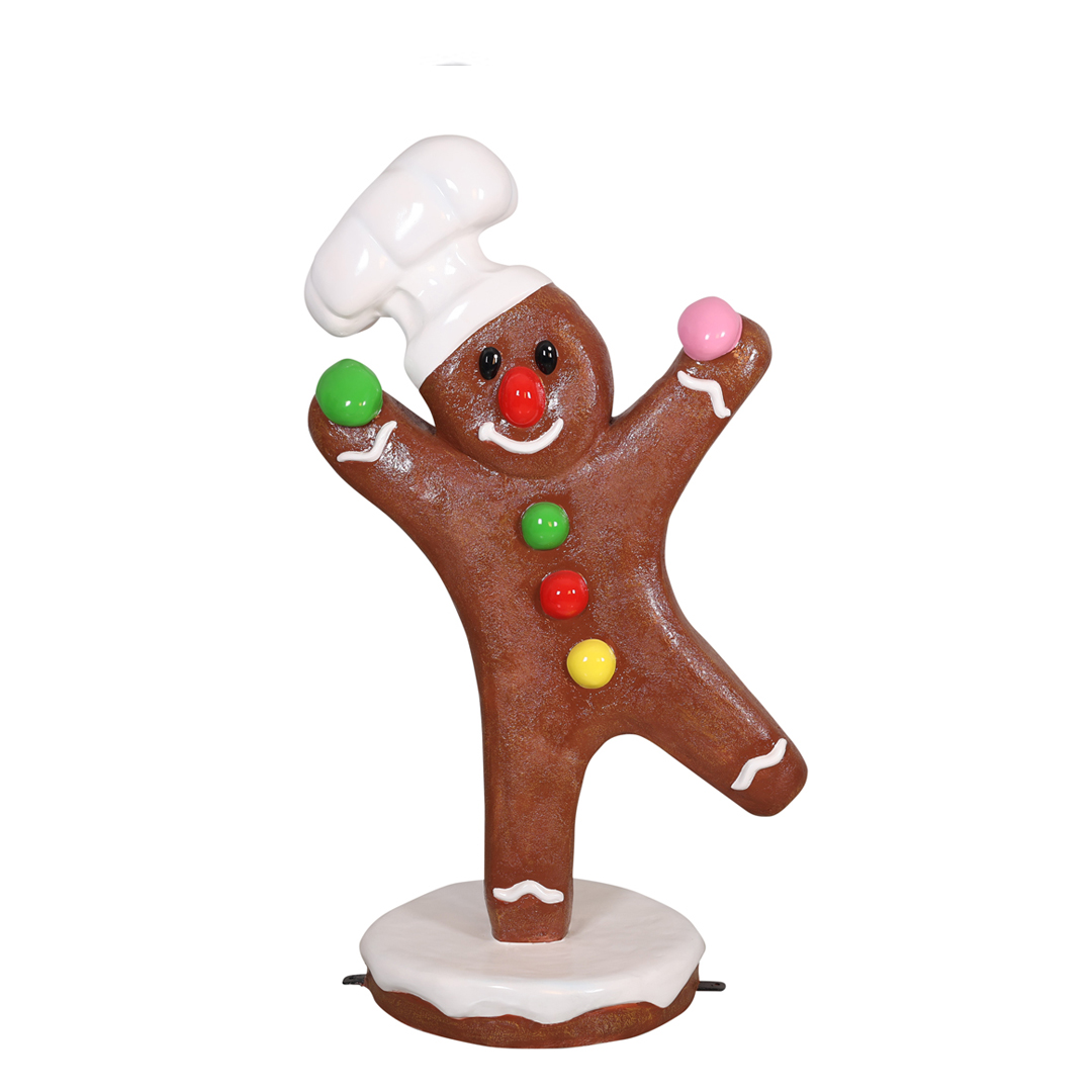 Dancing gingerbread man with a chef hat and colorful candy buttons on a white base.