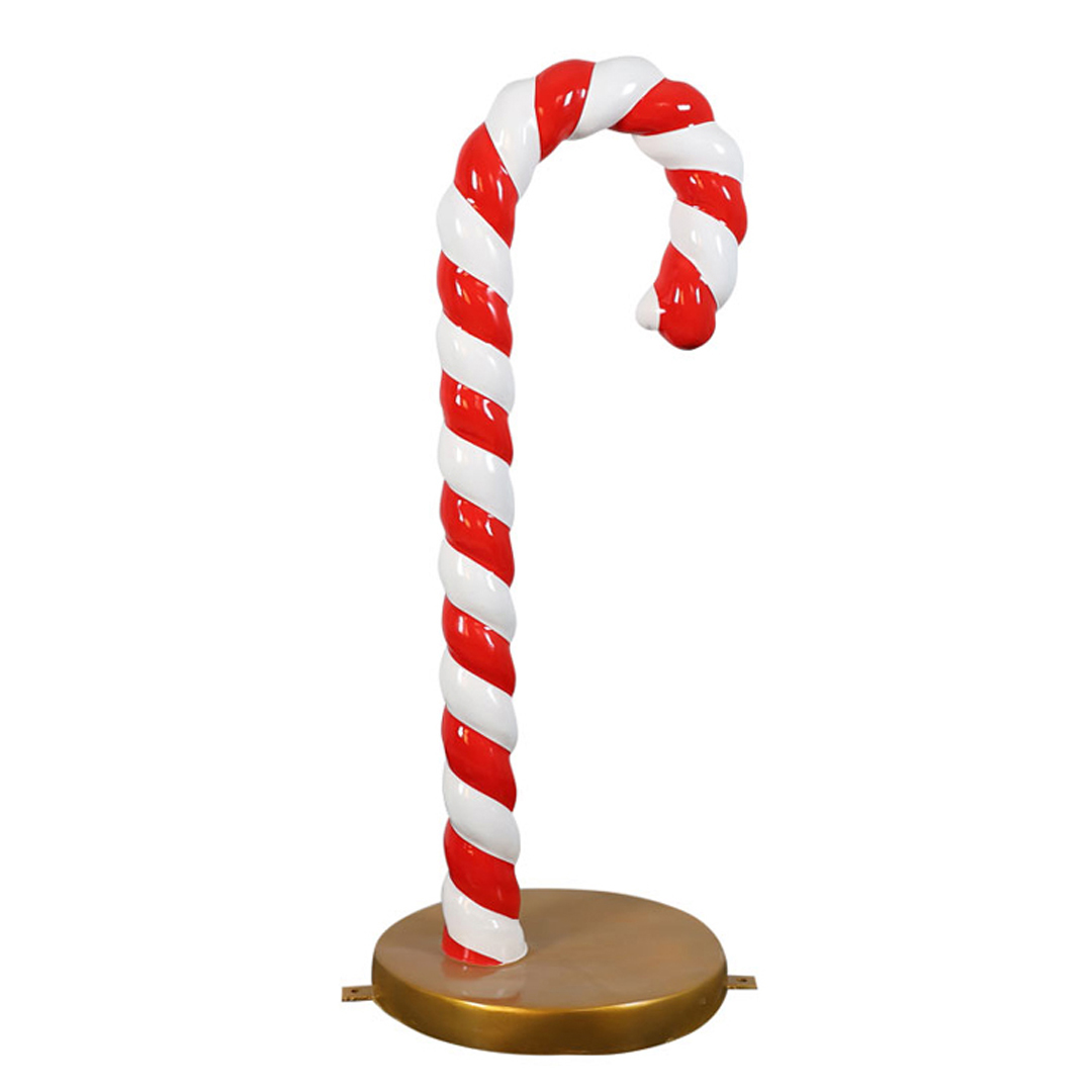 Large red and white striped candy cane decoration on a round gold base.