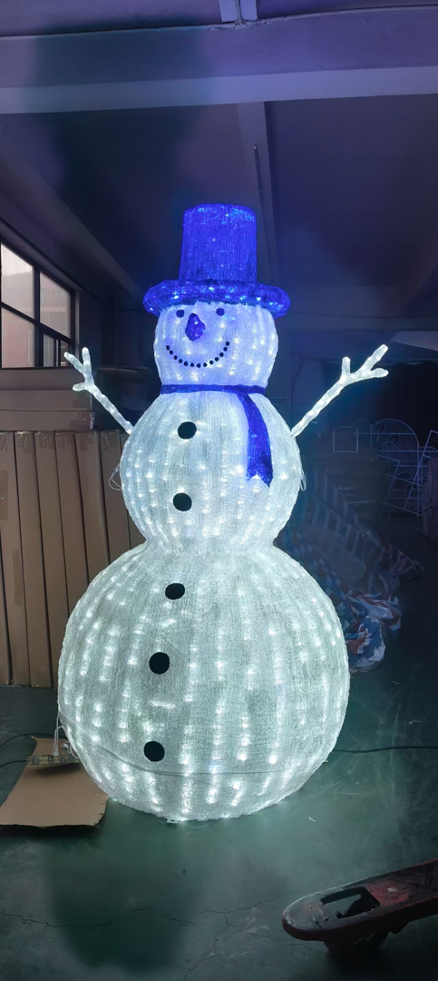 Large light-up snowman decoration with blue hat and scarf.