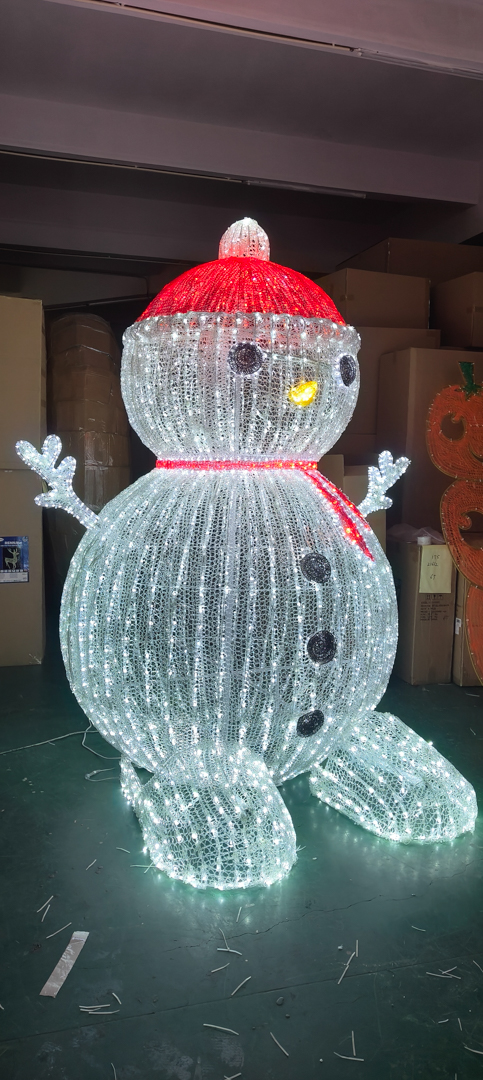 Large light up snowman decoration with red hat and scarf, black eyes and buttons.