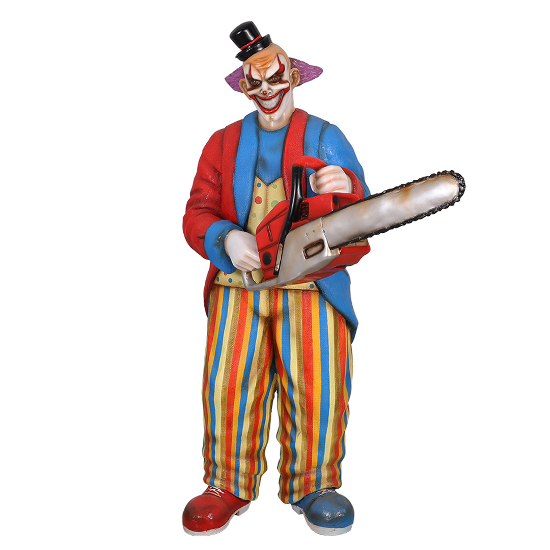 Scary clown figure holding a red chainsaw wearing a small top hat and colorful striped pants.
