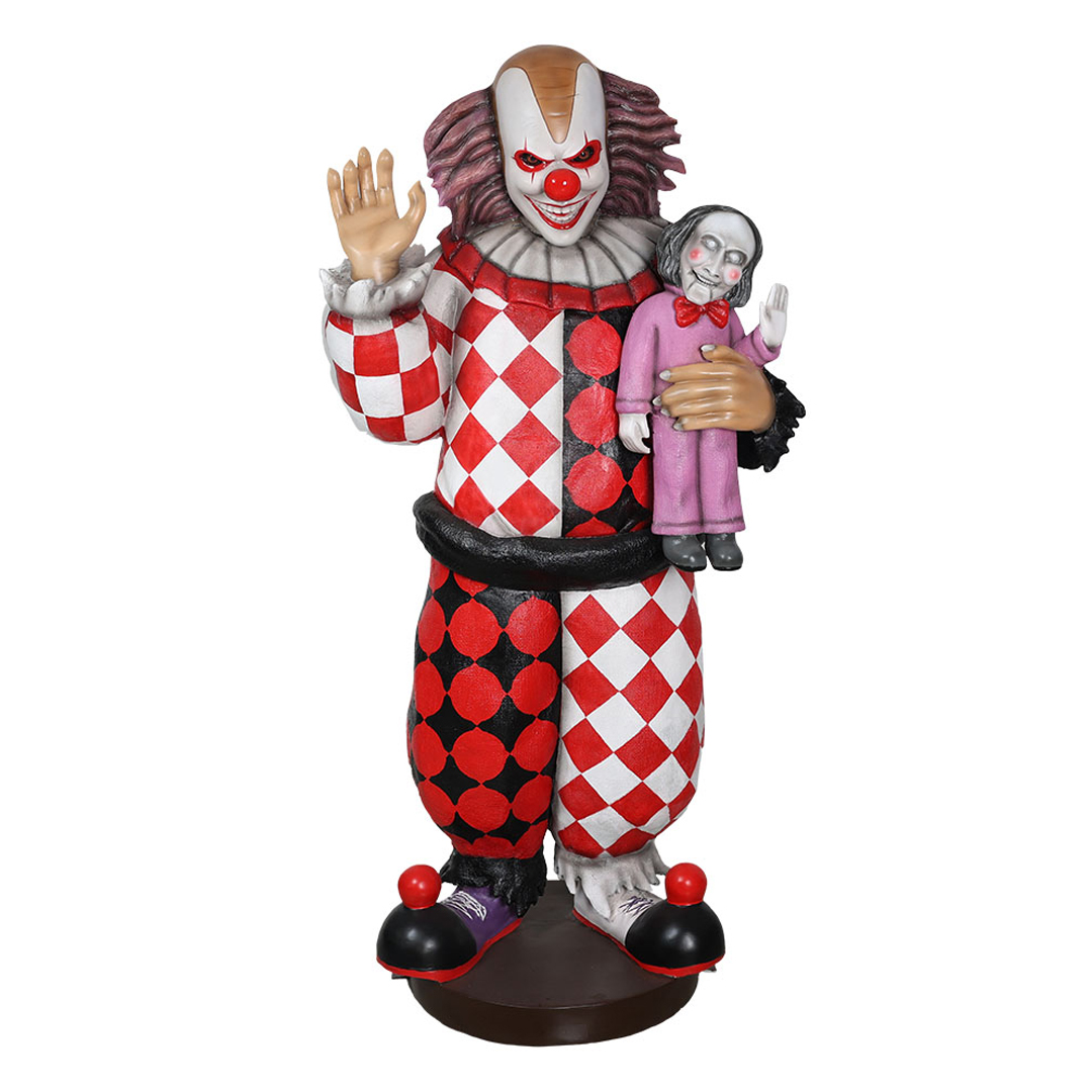 Scary clown figurine in red and white diamond costume holding a ventriloquist dummy, both waving.