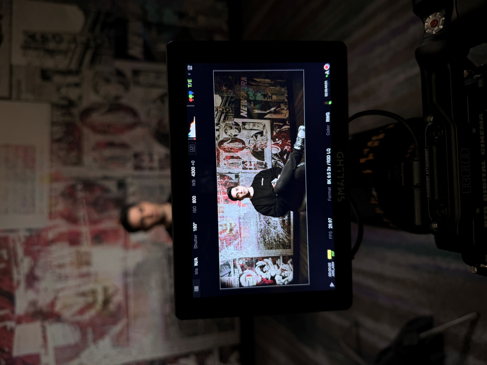 Close up of camera monitor showing the in-camera image from an interview.